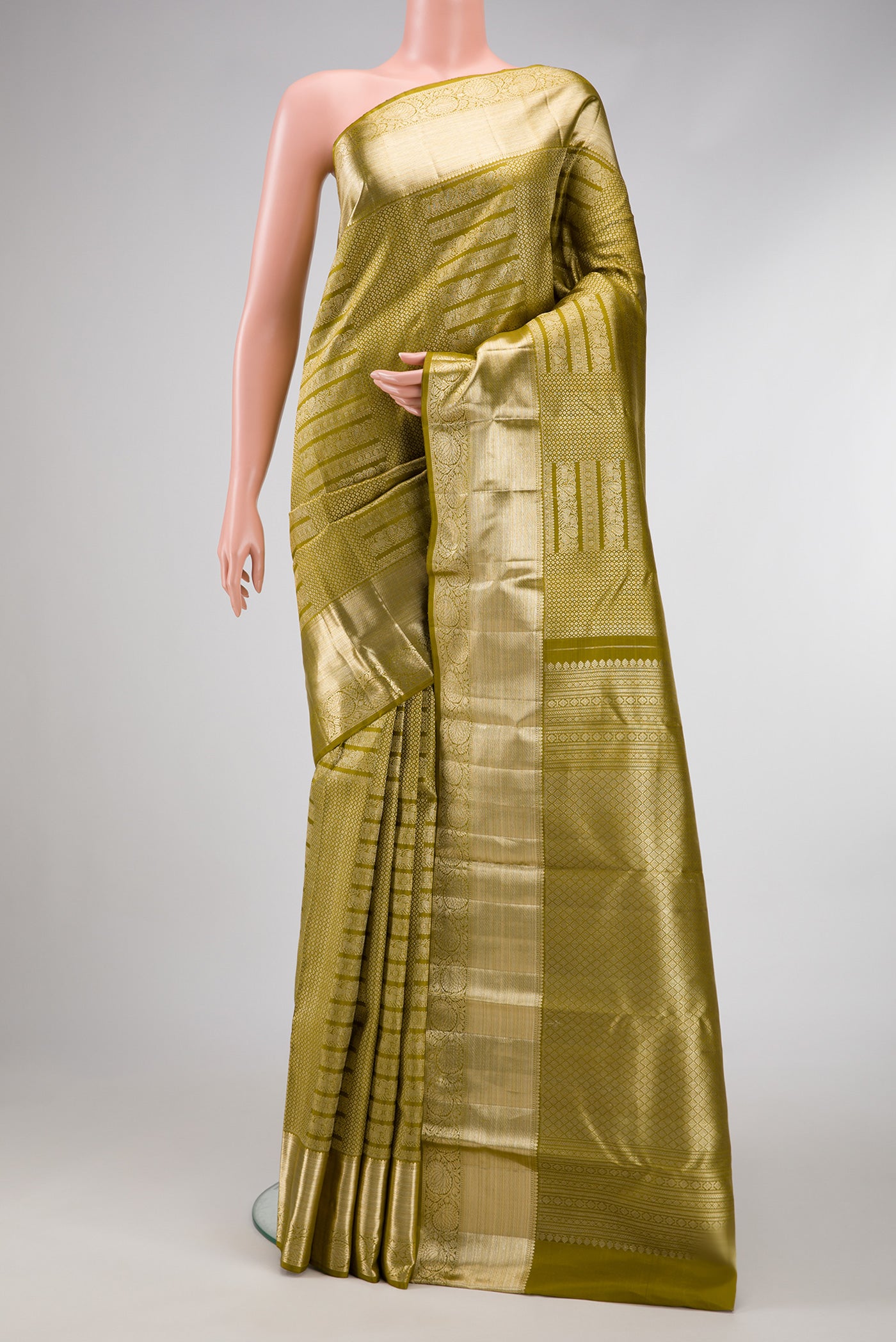 Mehandi Green Dual Tone Kanchipuram Silk Saree with Zari Brocade on the body and Zari Border.  displayed on a mannequin