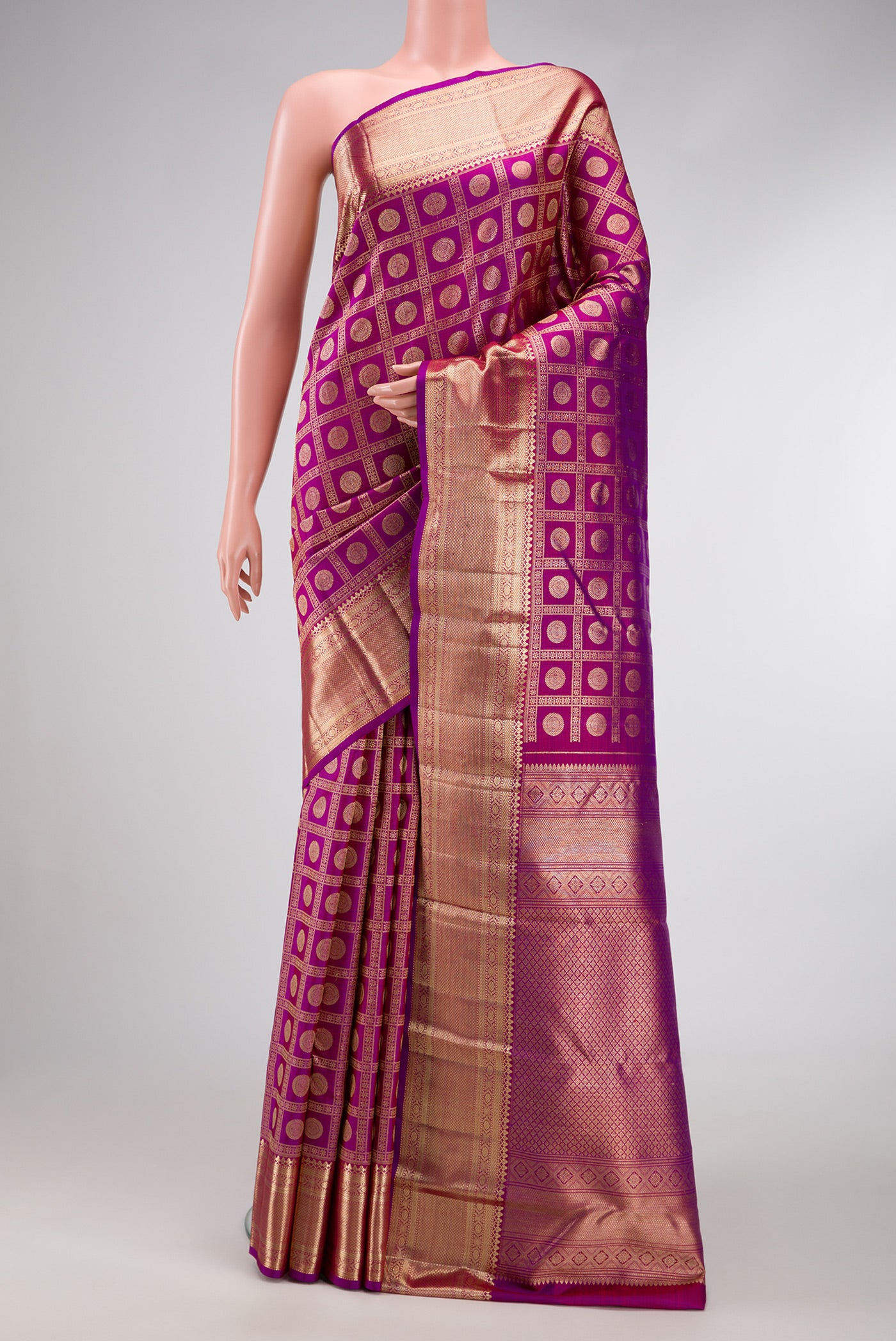 Magenta Dual Tone Kanchipuram Silk Saree with Zari Brocade on the body and Zari Border.  displayed on a mannequin