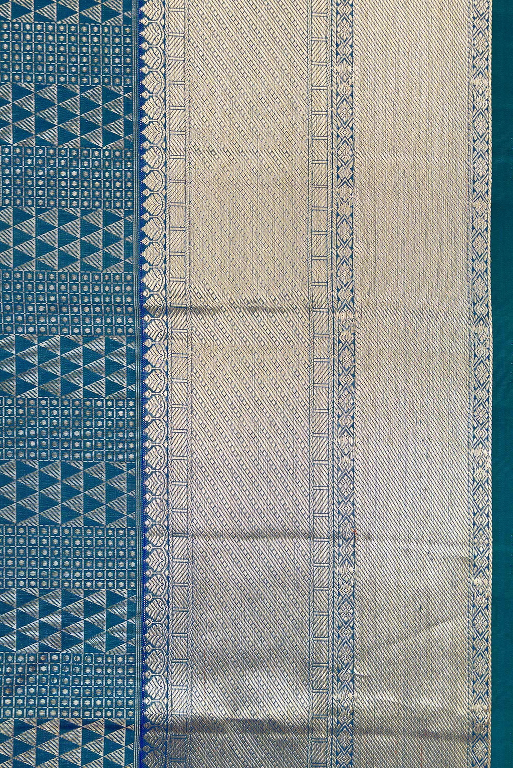 Border image of Peacock Blue Dual Tone Kanchipuram Silk Saree with Zari Brocade on the body and Zari Border. 