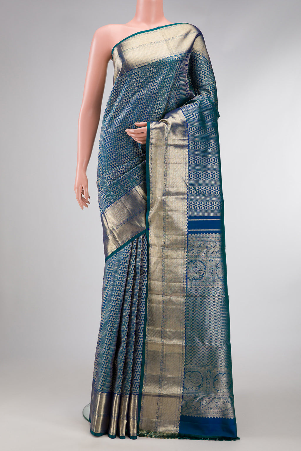 Peacock Blue Dual Tone Kanchipuram Silk Saree with Zari Brocade on the body and Zari Border.  displayed on a mannequin