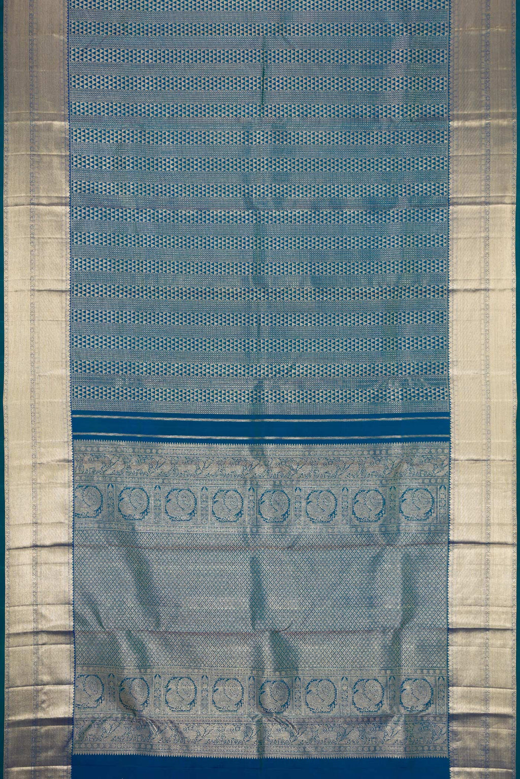 Flat view of Peacock Blue Dual Tone Kanchipuram Silk Saree with Zari Brocade on the body and Zari Border. 