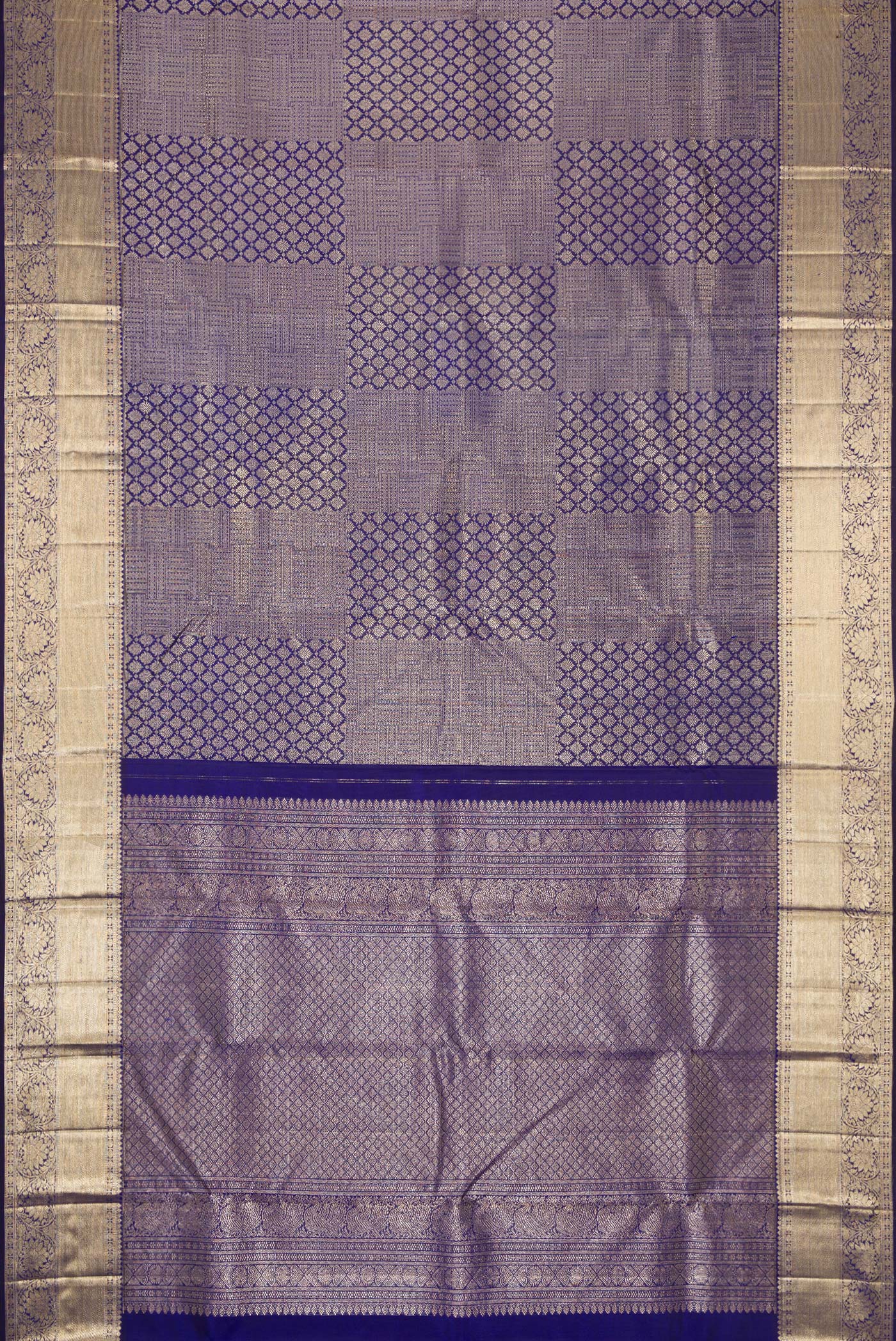 Flat view of Royal Blue Dual Tone Kanchipuram Silk Saree with Zari Brocade on the body and Zari Border. 