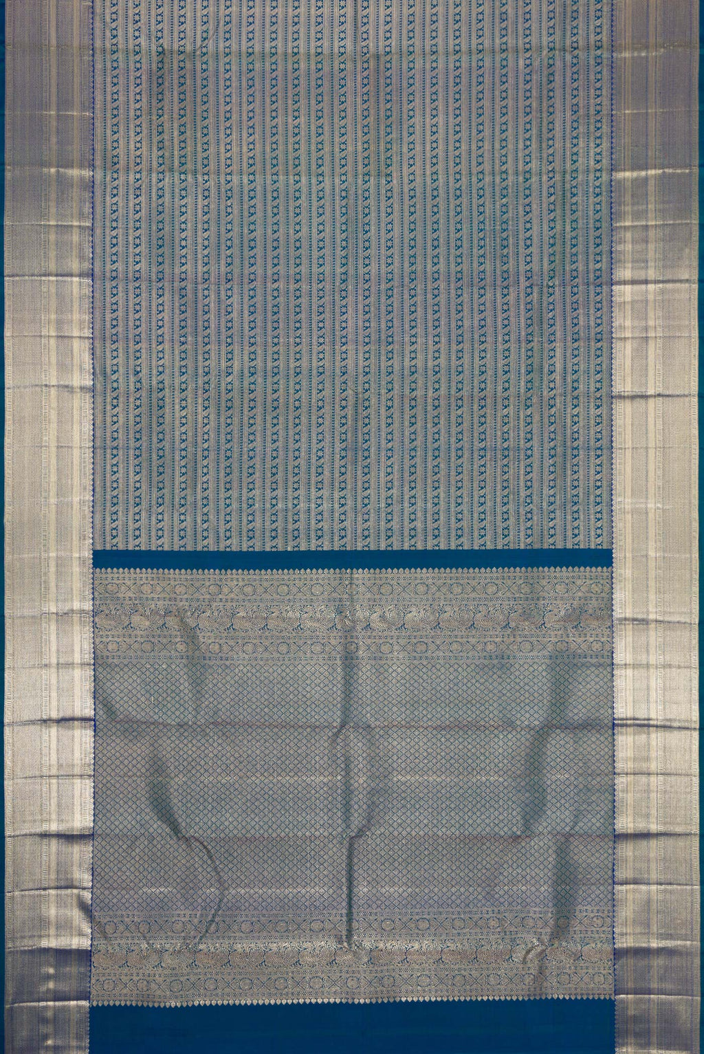 Flat view of Peacock Blue Dual Tone Kanchipuram Silk Saree with Zari Brocade on the body and Zari Border. 
