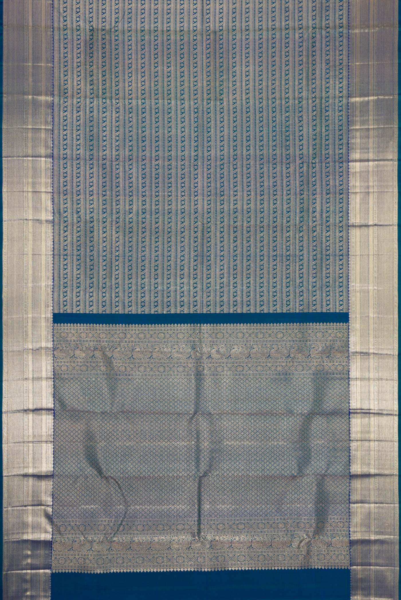 Flat view of Peacock Blue Dual Tone Kanchipuram Silk Saree with Zari Brocade on the body and Zari Border. 