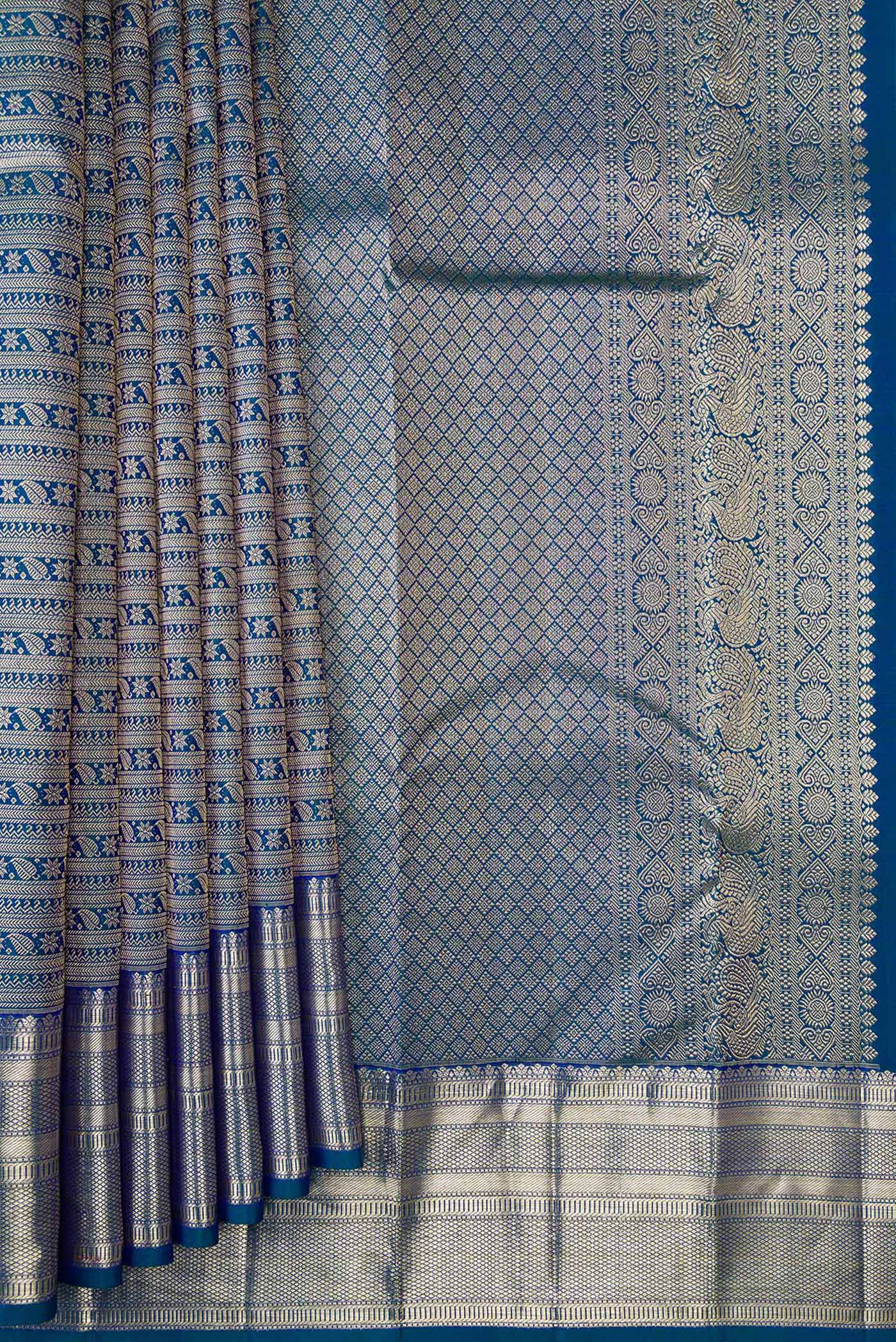Pleats and pallu of Peacock Blue Dual Tone Kanchipuram Silk Saree with Zari Brocade on the body and Zari Border. 