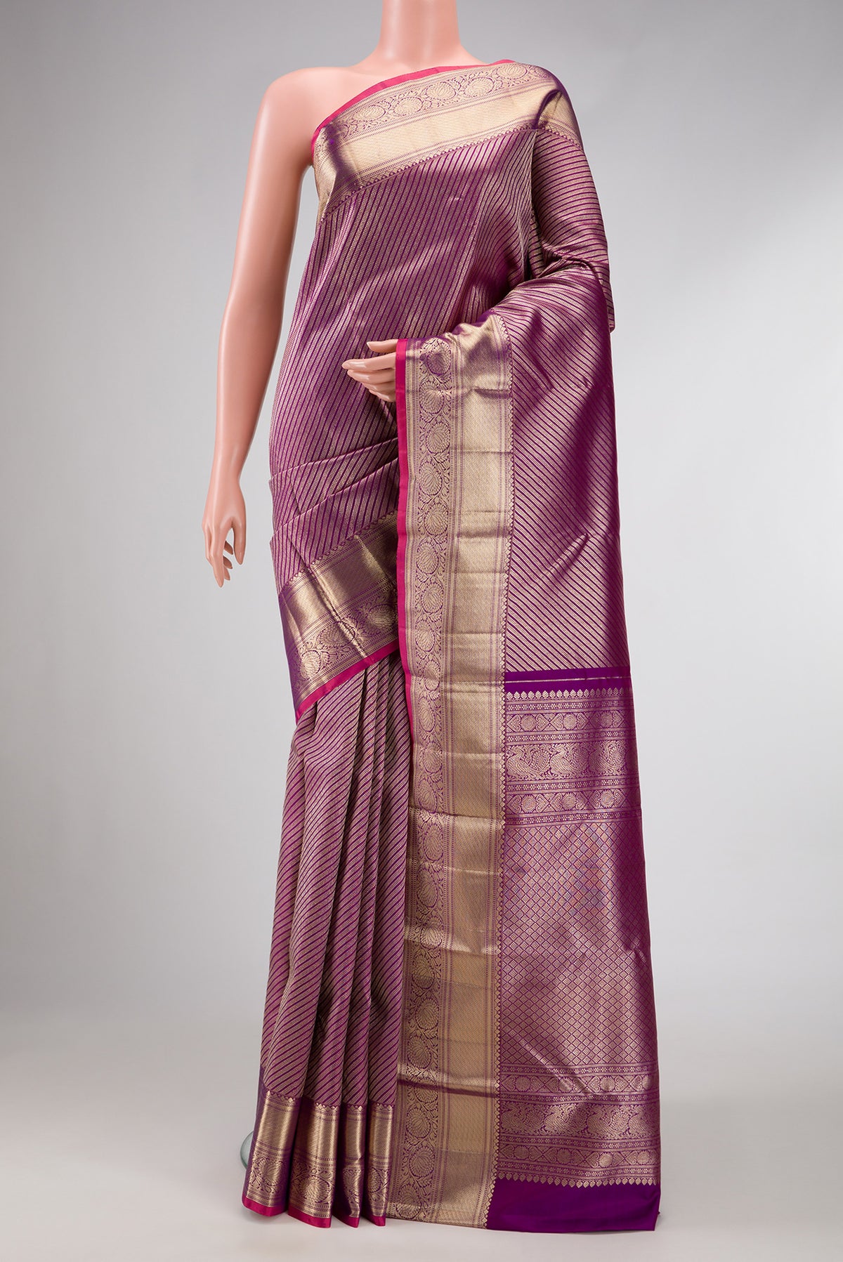 Purple Dual Tone Kanchipuram Silk Saree with Zari Brocade on the body and Zari Border.  displayed on a mannequin