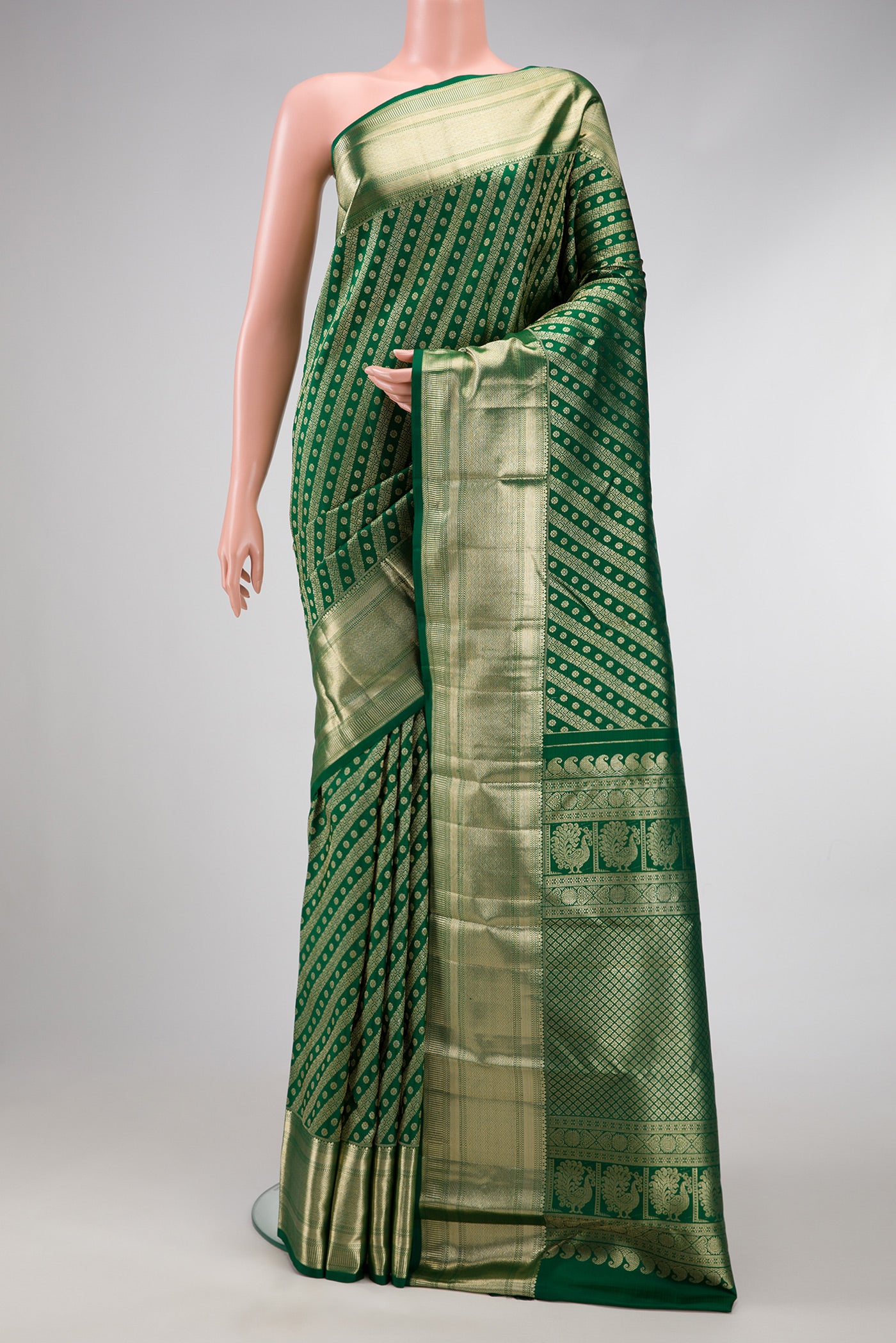 Green Dual Tone Kanchipuram Silk Saree with Zari Brocade on the body and Zari Border.  displayed on a mannequin