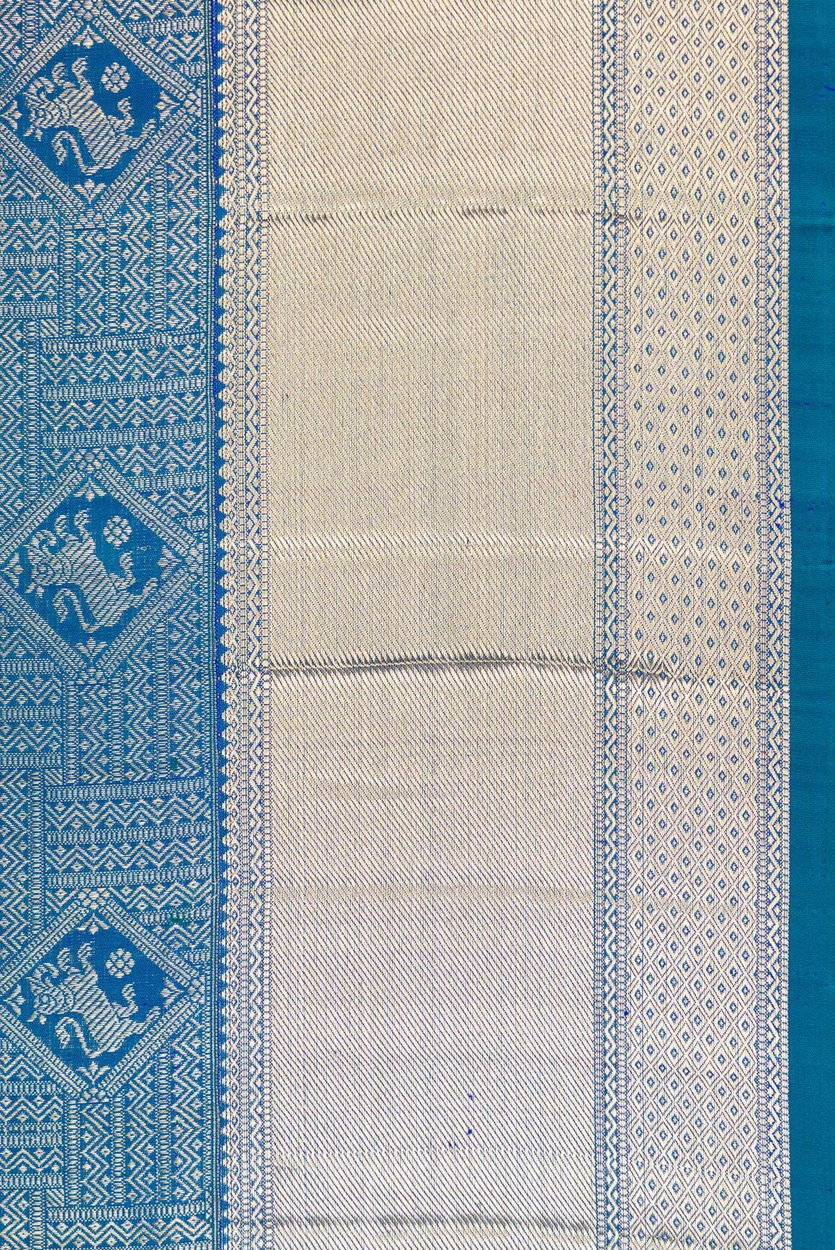 Border image of Peacock Blue Dual Tone Kanchipuram Silk Saree with Zari Brocade on the body and Zari Border. 