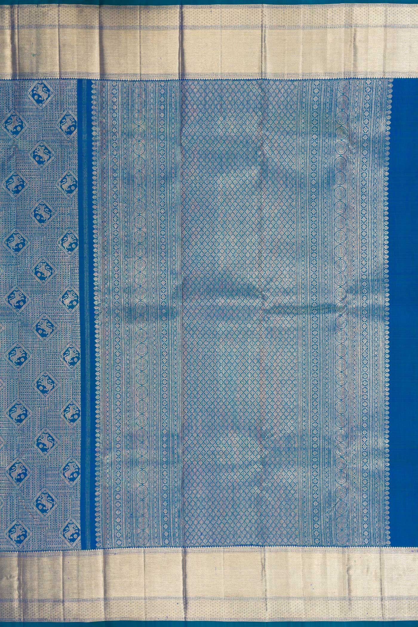 Close up image of the pallu of Peacock Blue Dual Tone Kanchipuram Silk Saree with Zari Brocade on the body and Zari Border. 