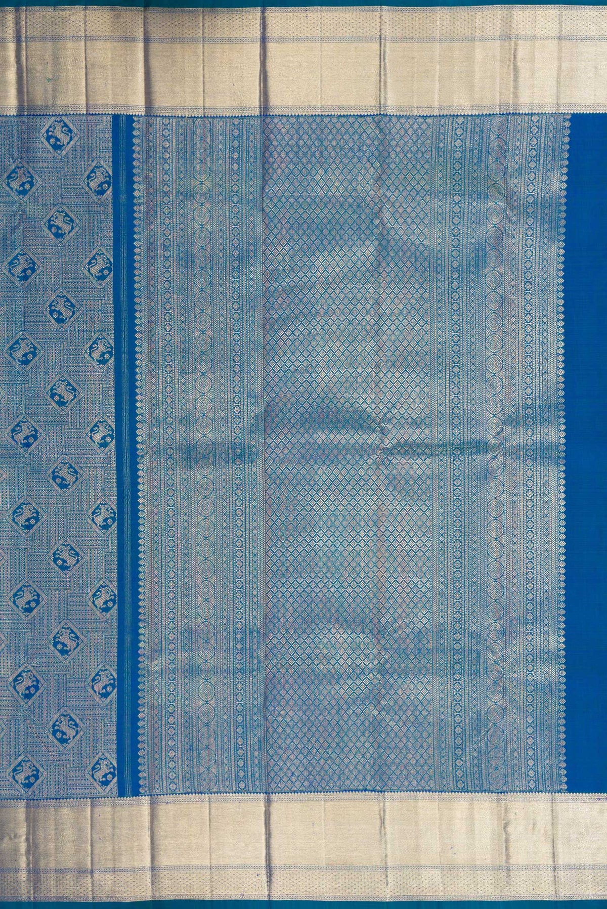 Close up image of the pallu of Peacock Blue Dual Tone Kanchipuram Silk Saree with Zari Brocade on the body and Zari Border. 