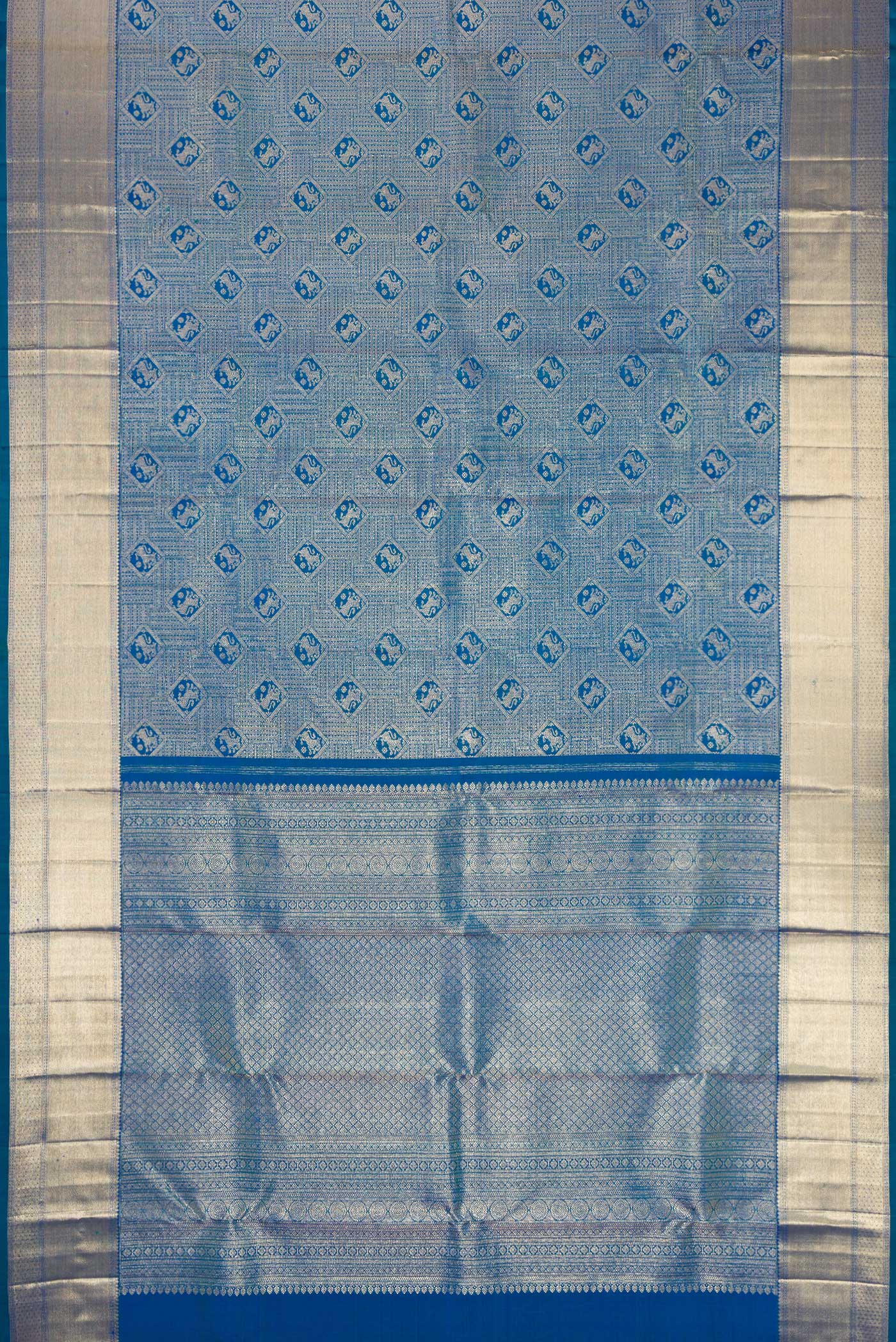 Flat view of Peacock Blue Dual Tone Kanchipuram Silk Saree with Zari Brocade on the body and Zari Border. 