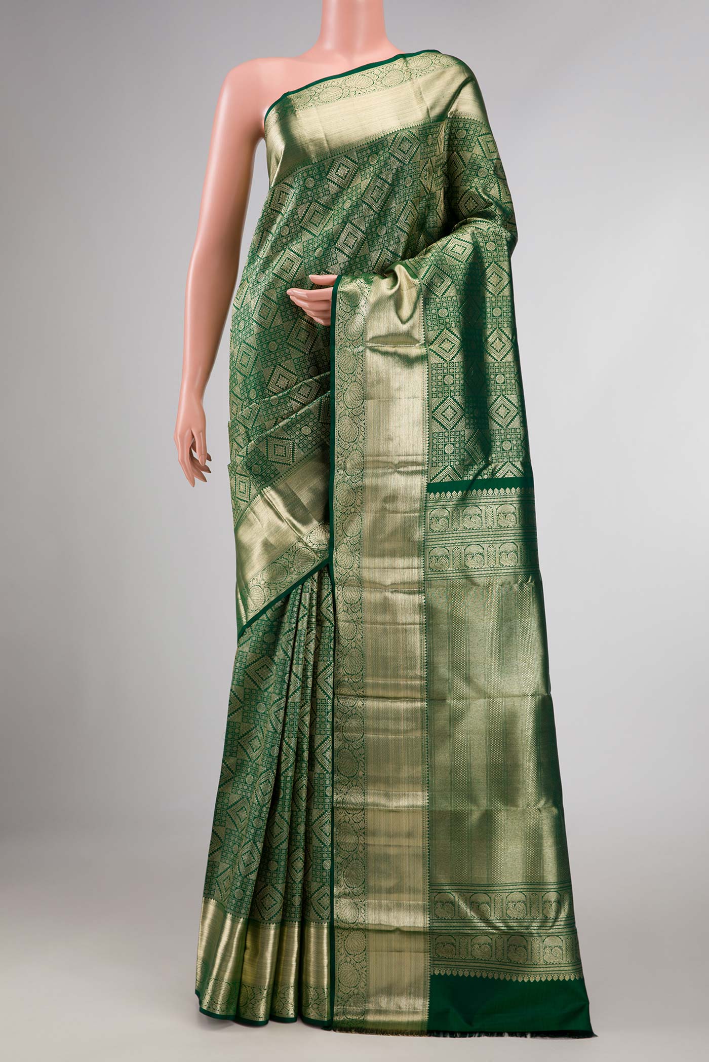 Bottle Green Dual Tone Kanchipuram Saree with Zari Brocade on the body and Zari Border displayed on a mannequin