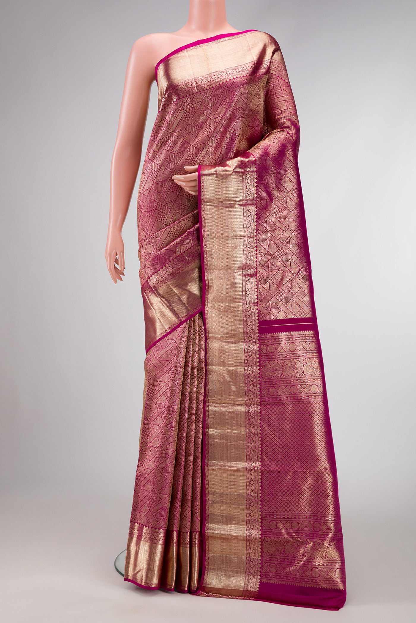 Magenta Dual Tone Kanchipuram Silk Saree with Zari Brocade on the body and Zari Border.  displayed on a mannequin