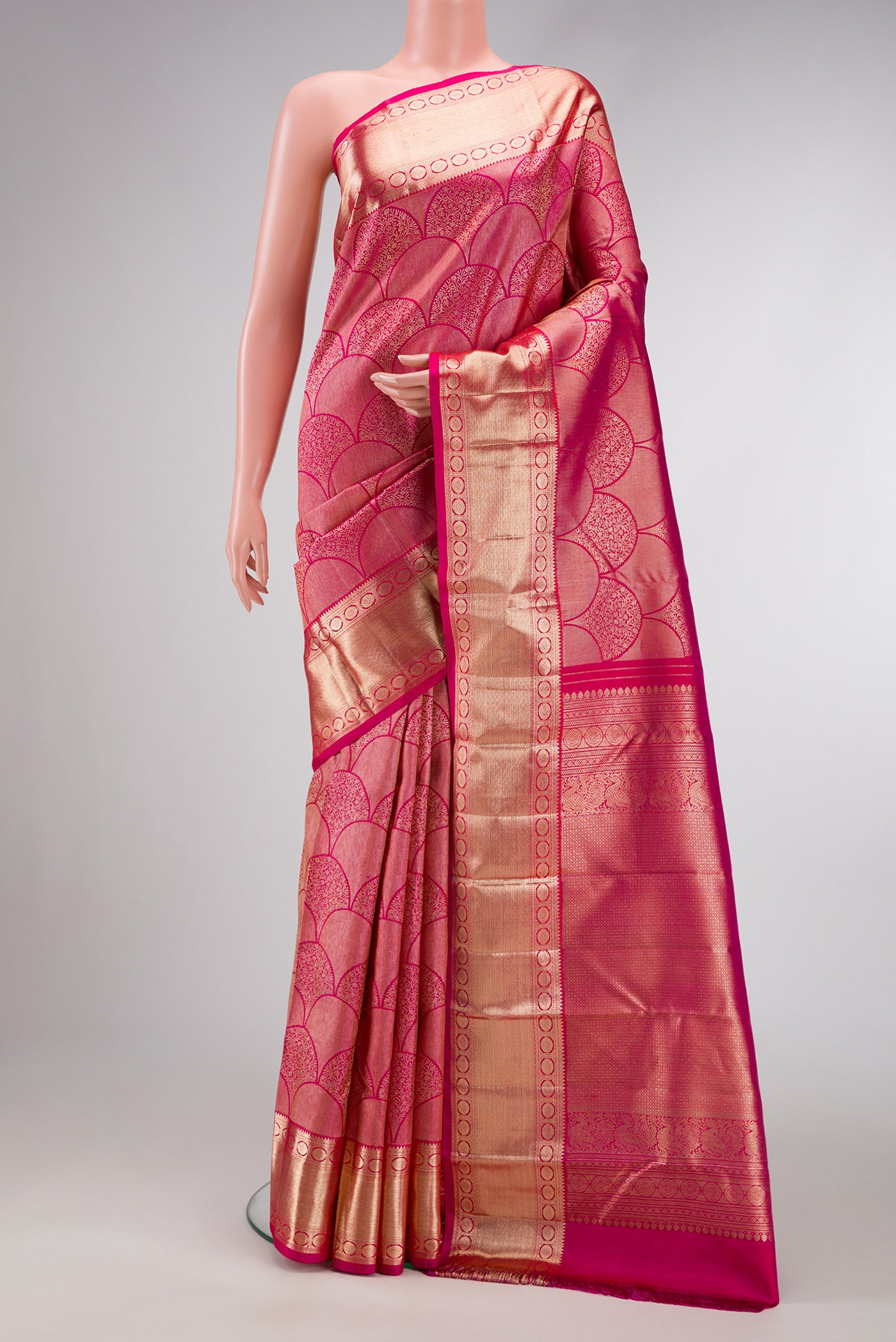 Pink Dual Tone Kanchipuram Silk Saree with Zari Brocade on the body and Zari Border.  displayed on a mannequin
