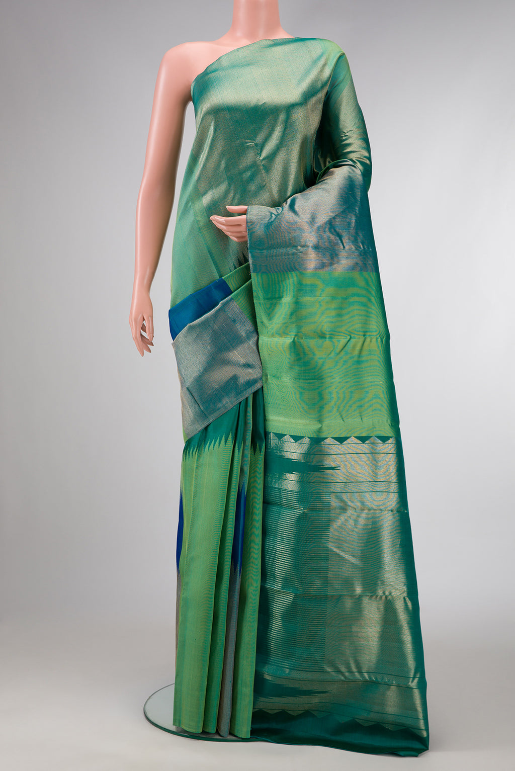Green and Peacock Blue Color Kanchipuram Silk Saree with Zari Brocade on the body and Without Border.  displayed on a mannequin