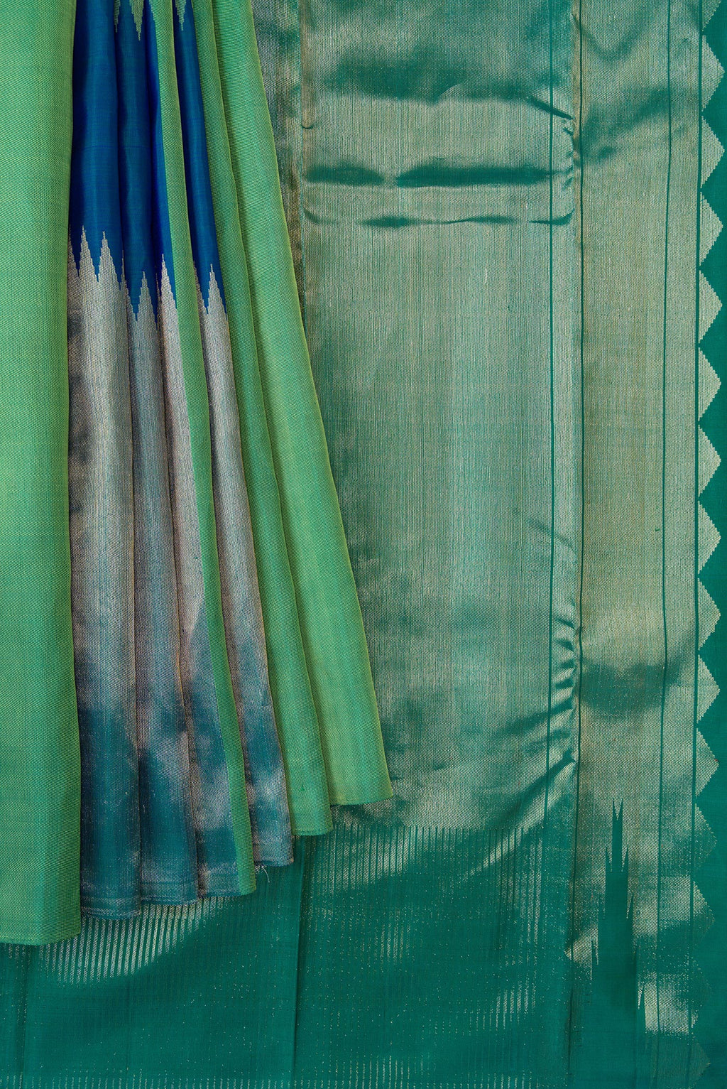 Pleats and pallu of Green and Peacock Blue Color Kanchipuram Silk Saree with Zari Brocade on the body and Without Border. 