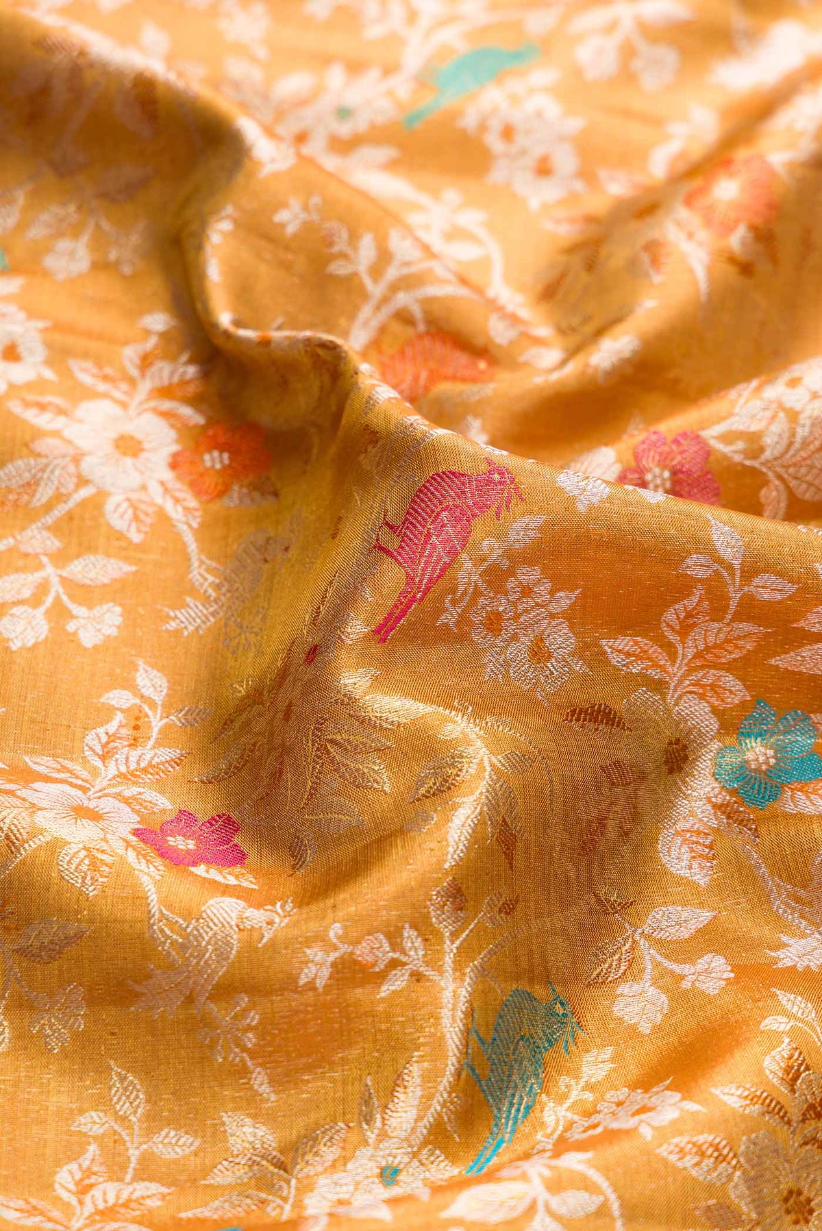 Close up of Gold Dual Tone Kanchipuram Silk Saree with Zari Brocade on the body and Zari Border displaying folds