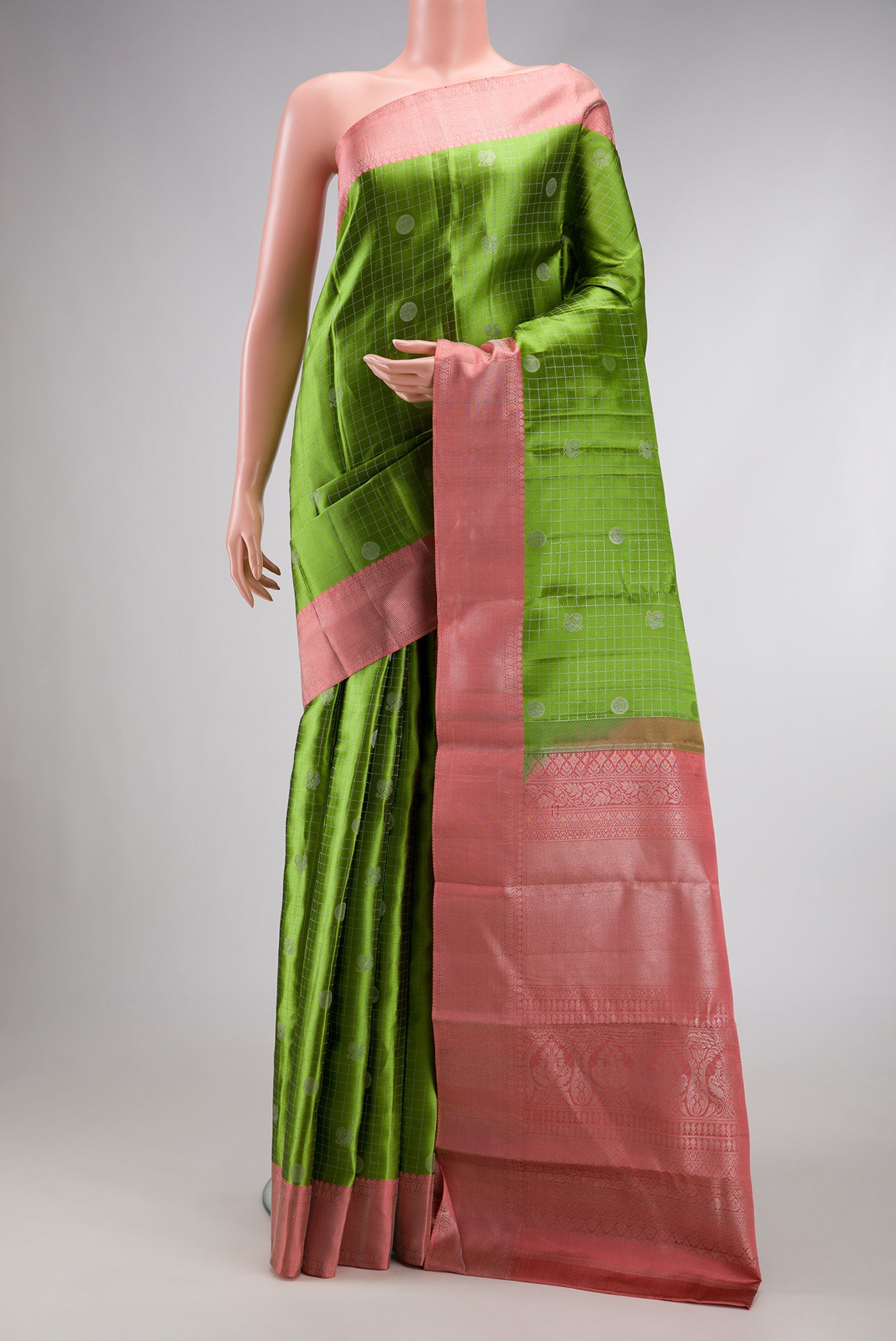 Mehandi Green Dual Tone Kanjivaram Silk Saree with Zari Brocade on the body and Zari Border.  displayed on a mannequin