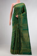 Bottle Green Dual Tone Kanjivaram Silk Saree with Zari Brocade on the body and Zari Border.  displayed on a mannequin