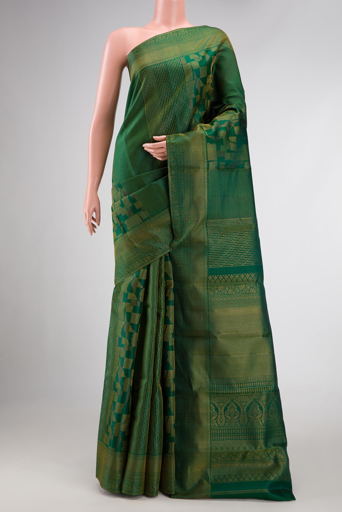 Bottle Green Dual Tone Kanjivaram Silk Saree with Zari Brocade on the body and Zari Border.  displayed on a mannequin