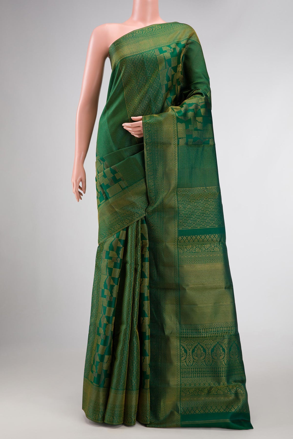 Bottle Green Dual Tone Kanjivaram Silk Saree with Zari Brocade on the body and Zari Border.  displayed on a mannequin