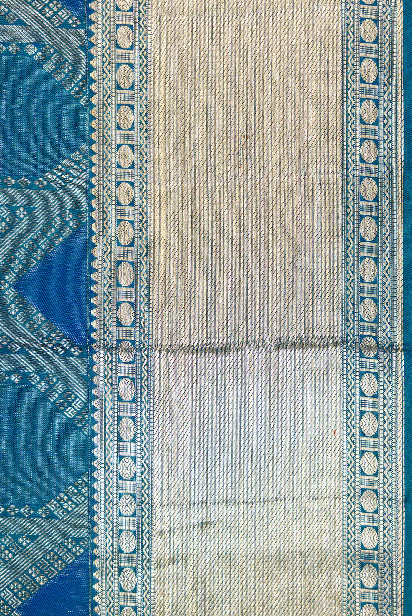 Border image of Peacock Blue Dual Tone Kanjivaram Silk Saree with Zari Brocade on the body and Zari Border. 
