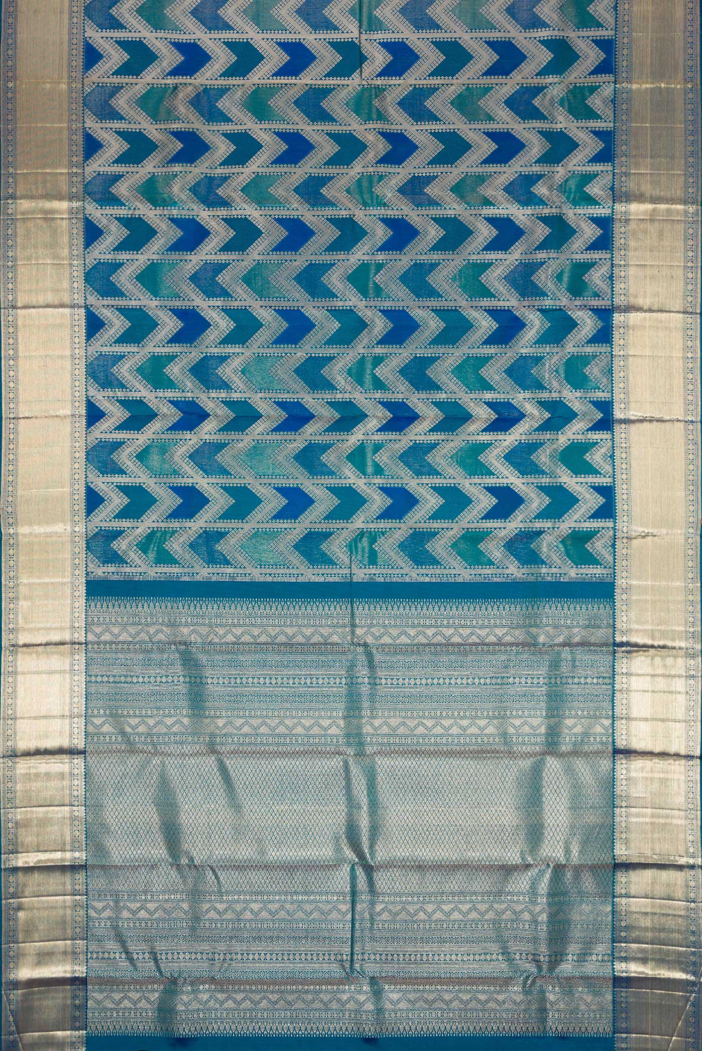 Flat view of Peacock Blue Dual Tone Kanjivaram Silk Saree with Zari Brocade on the body and Zari Border. 