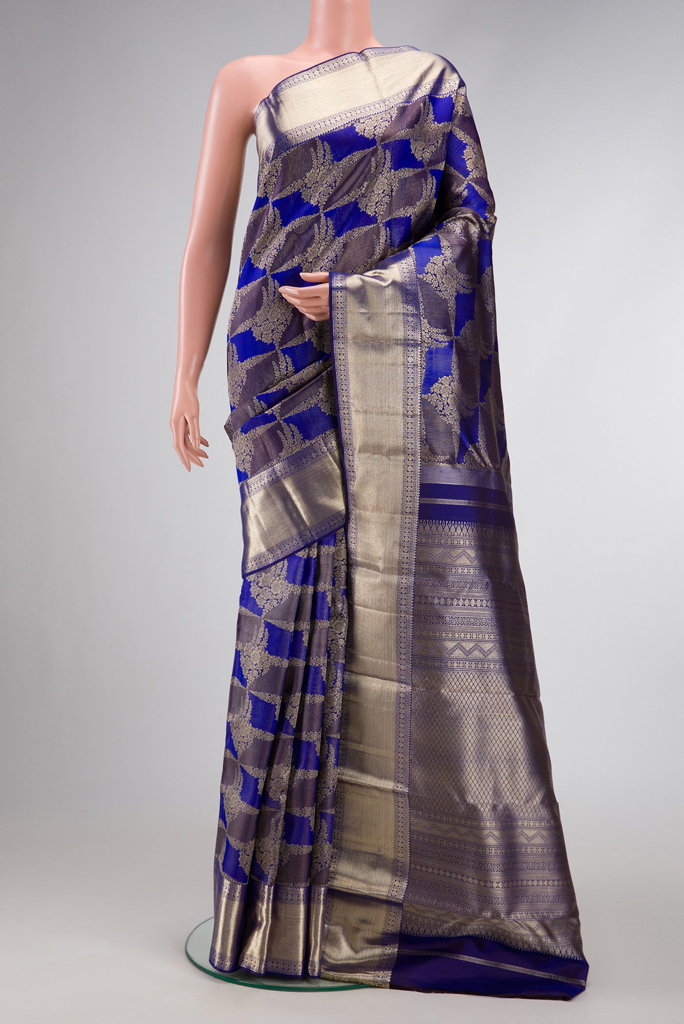 Violet Dual Tone Kanjivaram Silk Saree with Zari Brocade on the body and Zari Border.  displayed on a mannequin