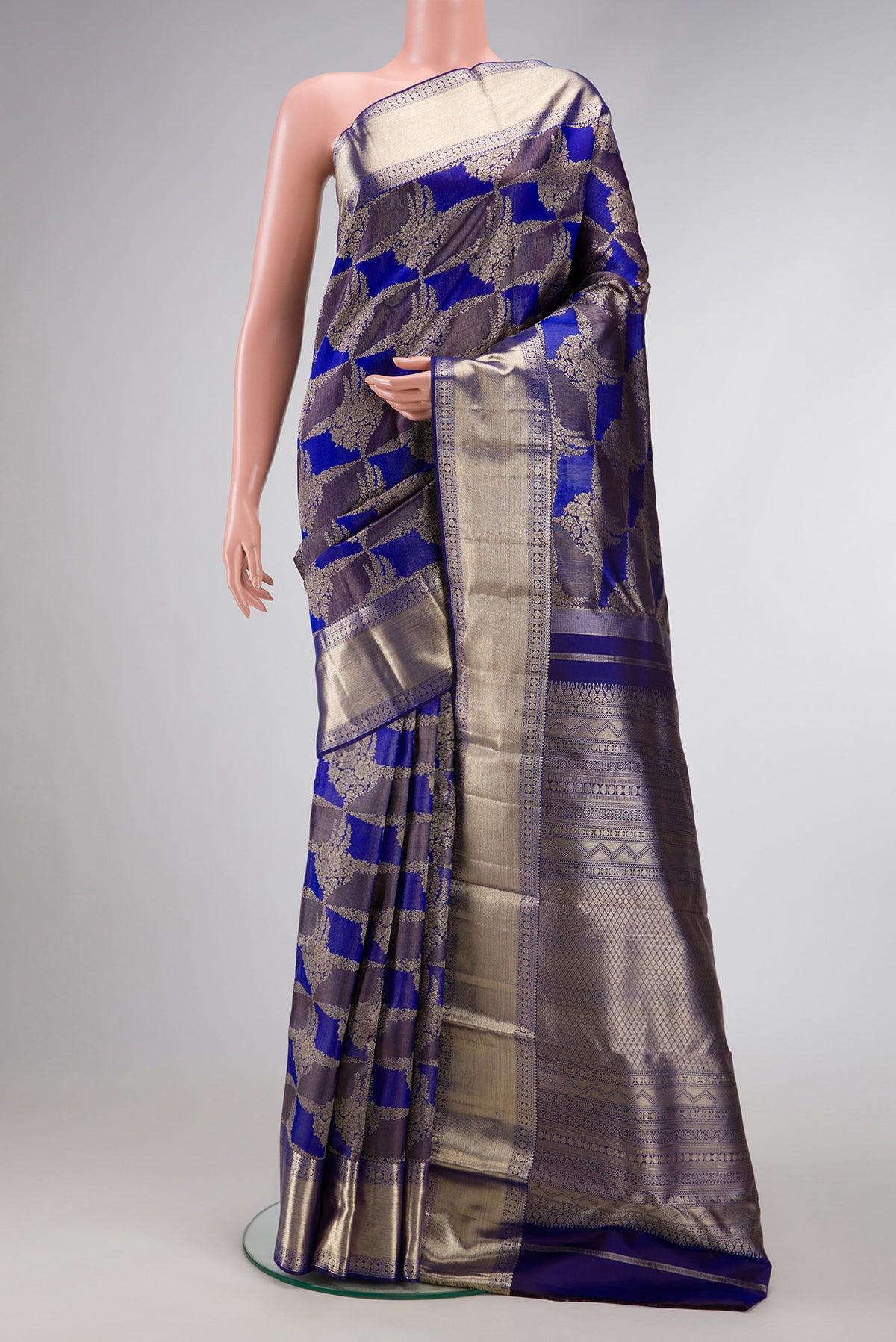 Violet Dual Tone Kanjivaram Silk Saree with Zari Brocade on the body and Zari Border.  displayed on a mannequin