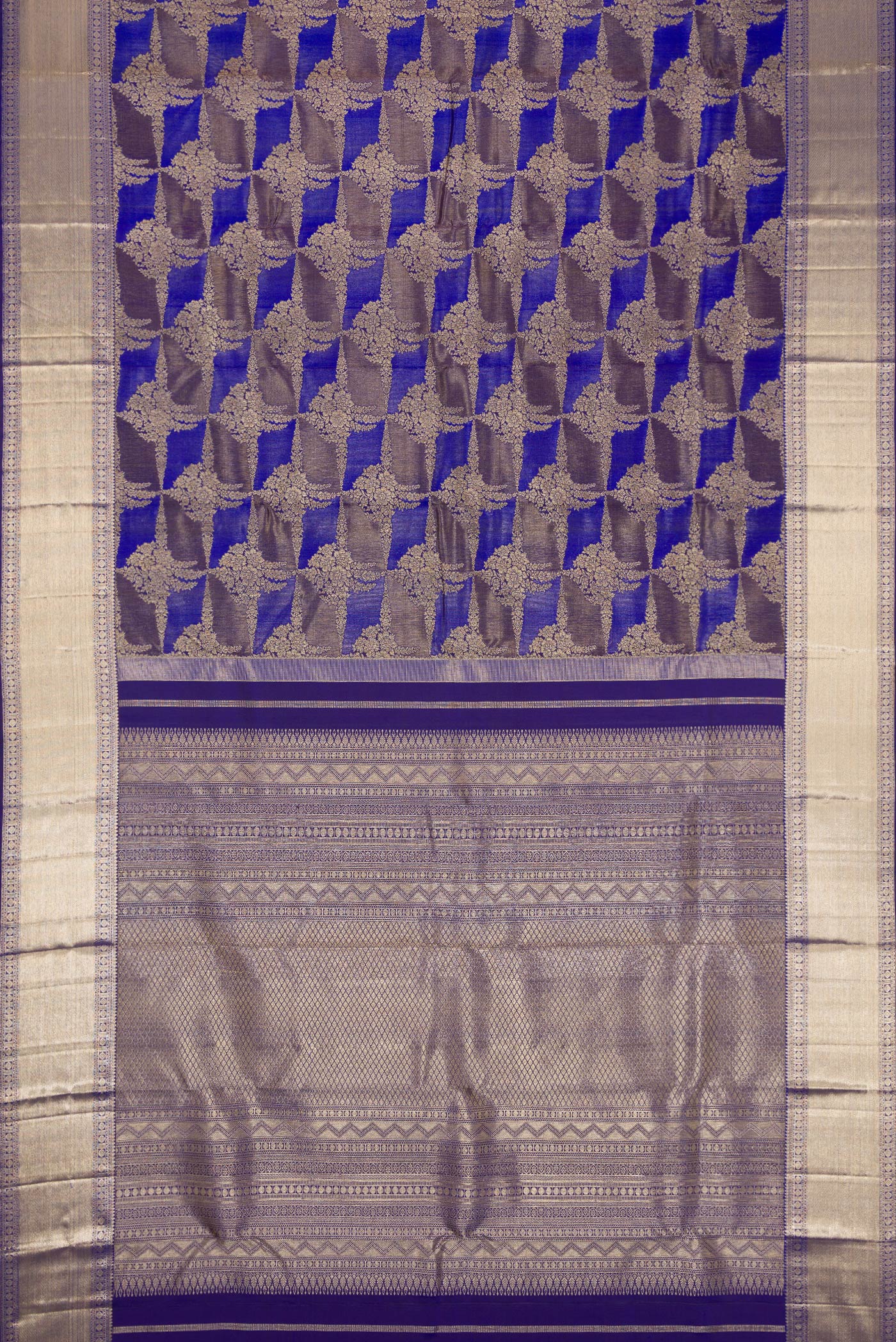 Flat view of Violet Dual Tone Kanjivaram Silk Saree with Zari Brocade on the body and Zari Border. 