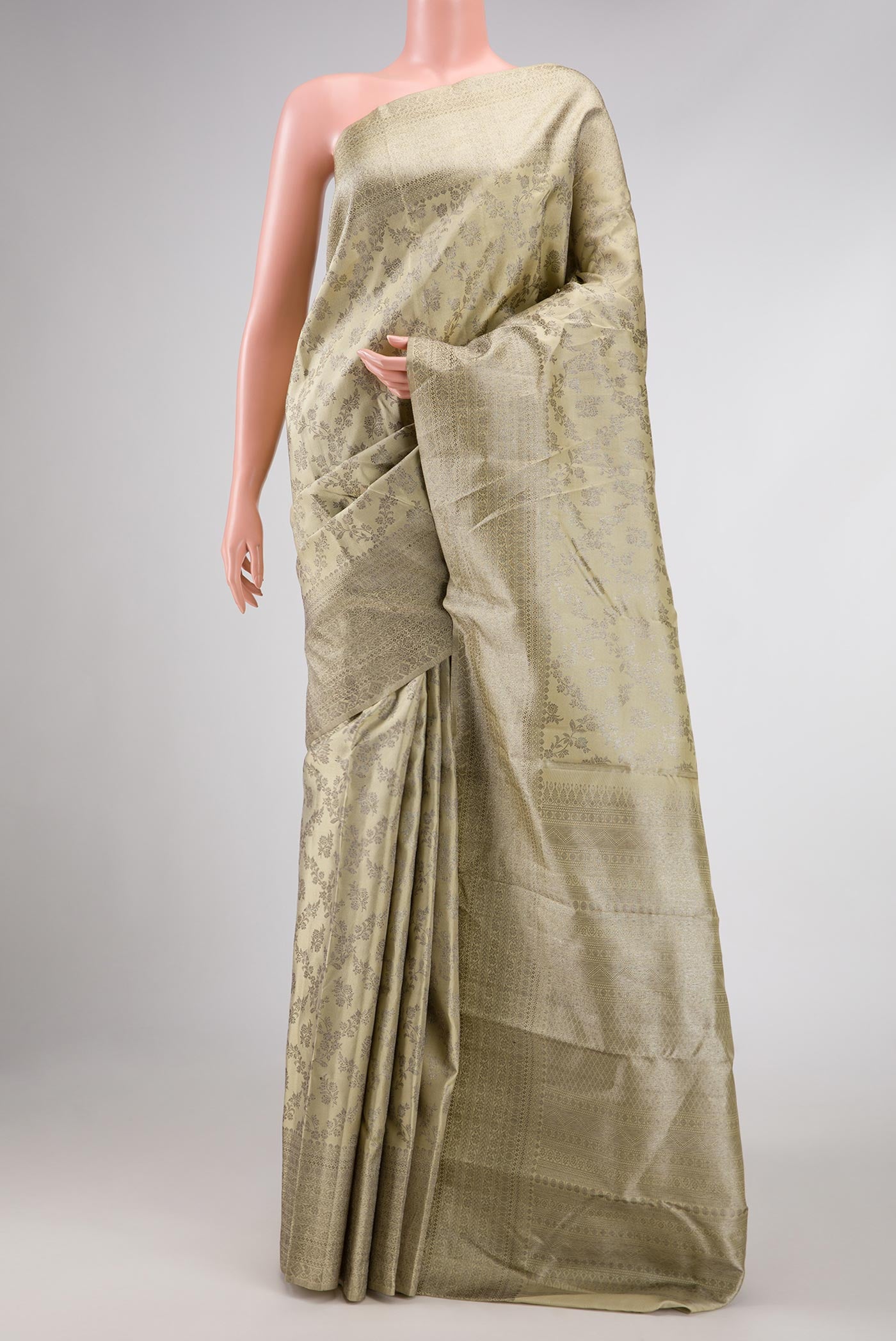 Beige Dual Tone Kanchipuram Silk Saree with Zari Brocade on the body and Zari Border displayed on a mannequin