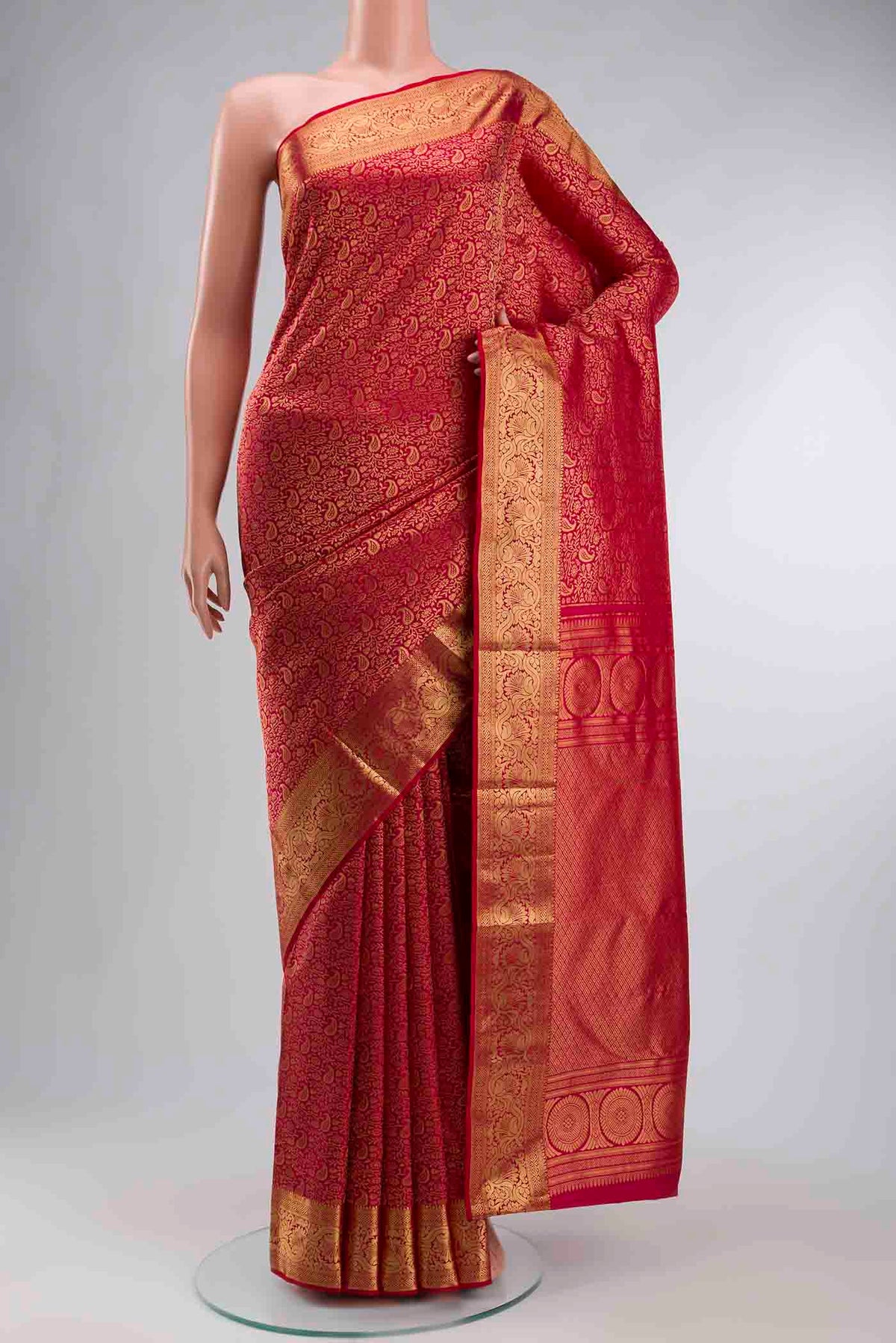 Pink Kanchipuram Silk Saree with Zari Brocade on the body and Zari Border displayed on a mannequin