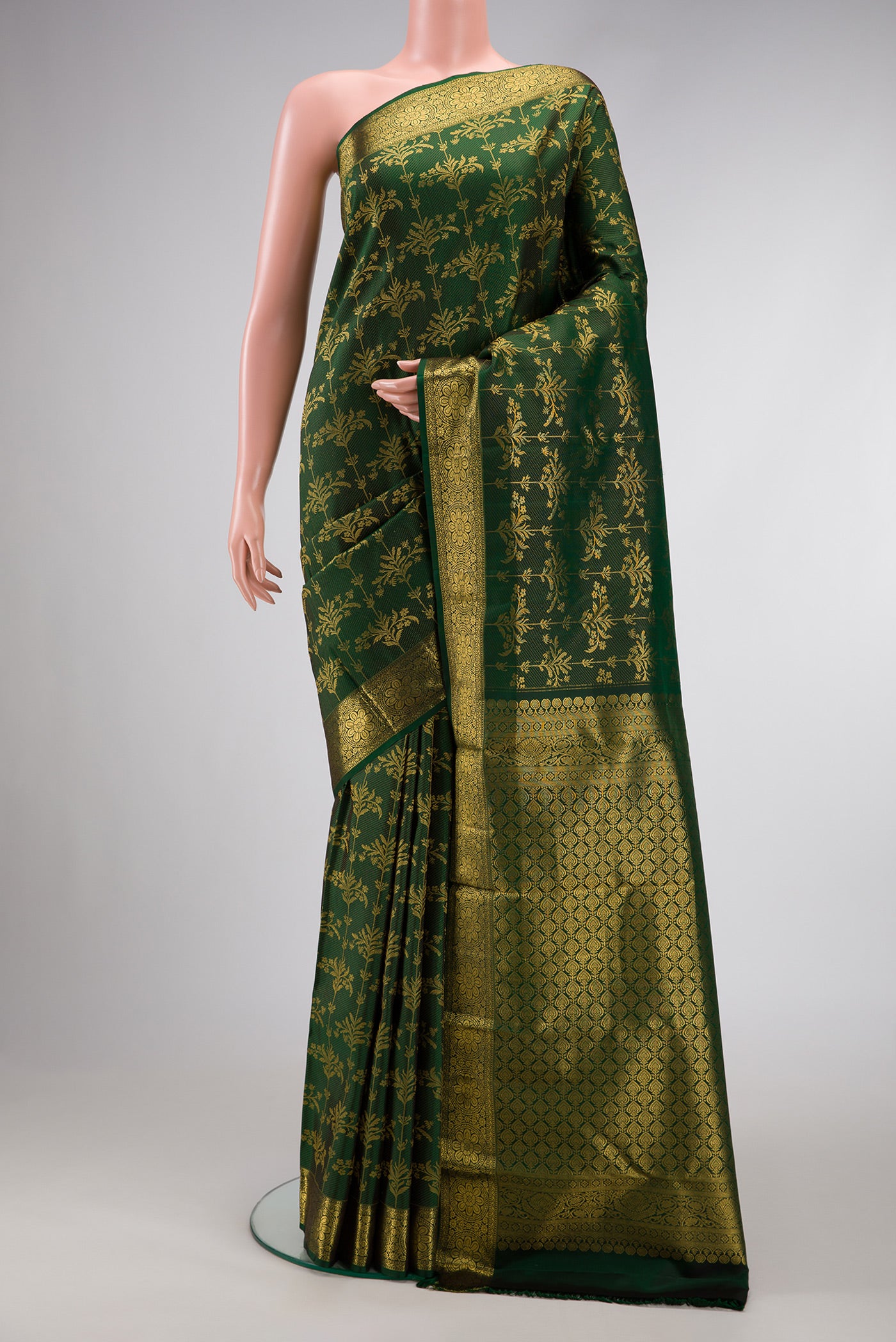 Green Dual Tone Kanjivaram Silk Saree with Zari Brocade on the body and Zari Border.  displayed on a mannequin