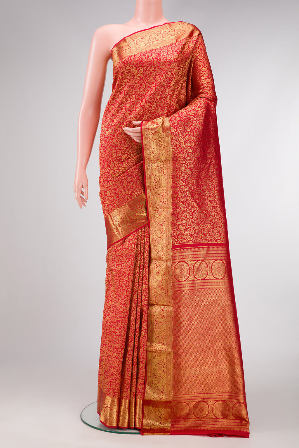 Red Dual Tone Kanjivaram Silk Saree with Zari Brocade on the body and Zari Border.  displayed on a mannequin