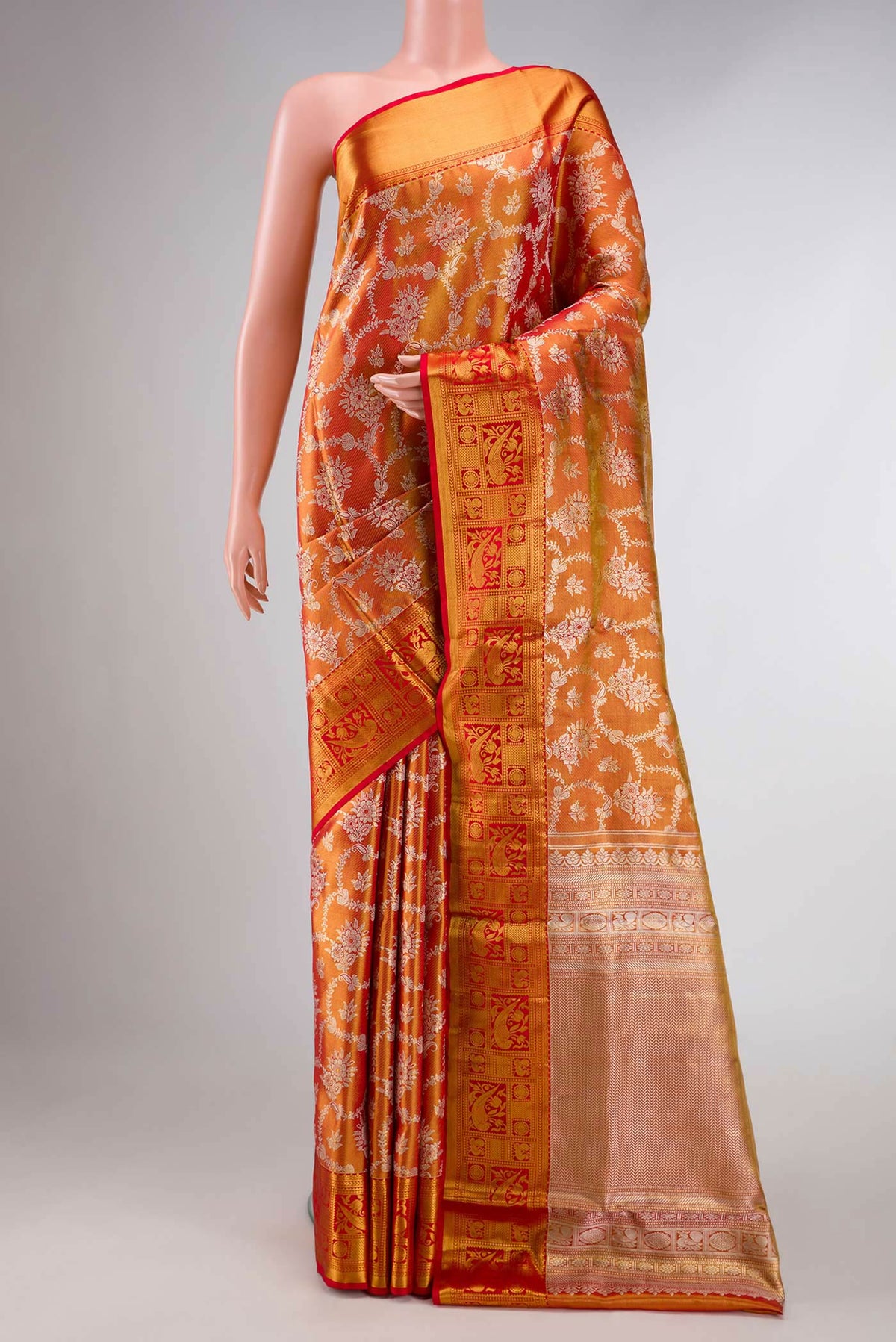 Red Dual Tone Kanchipuram Tissue Silk Saree with Zari Brocade on the body and Zari Border displayed on a mannequin