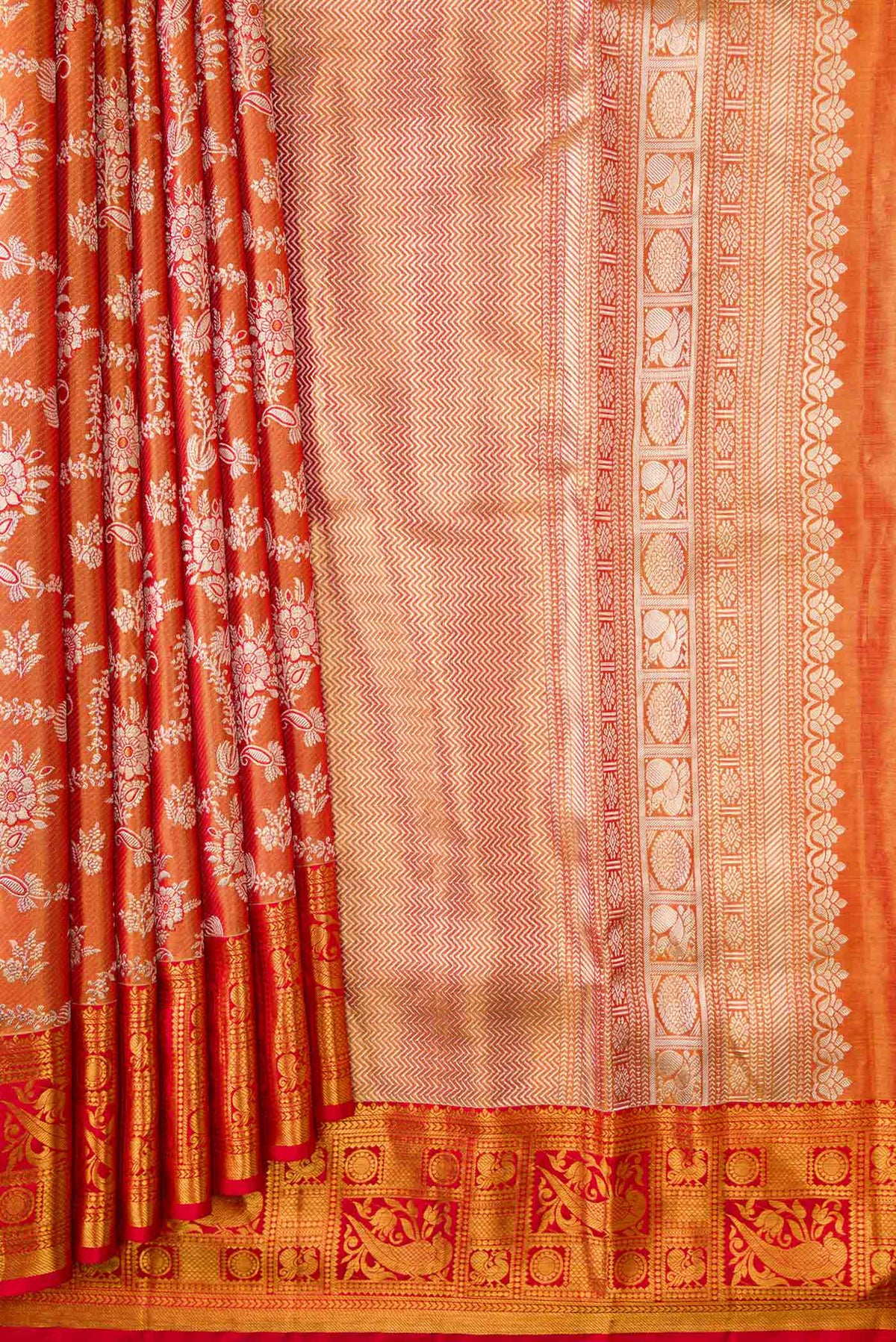 Pleats and pallu of Red Dual Tone Kanchipuram Tissue Silk Saree with Zari Brocade on the body and Zari Border