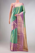 Green Dual Tone Kanchipuram Tissue Silk Saree with Zari Brocade on the body and Zari Border displayed on a mannequin