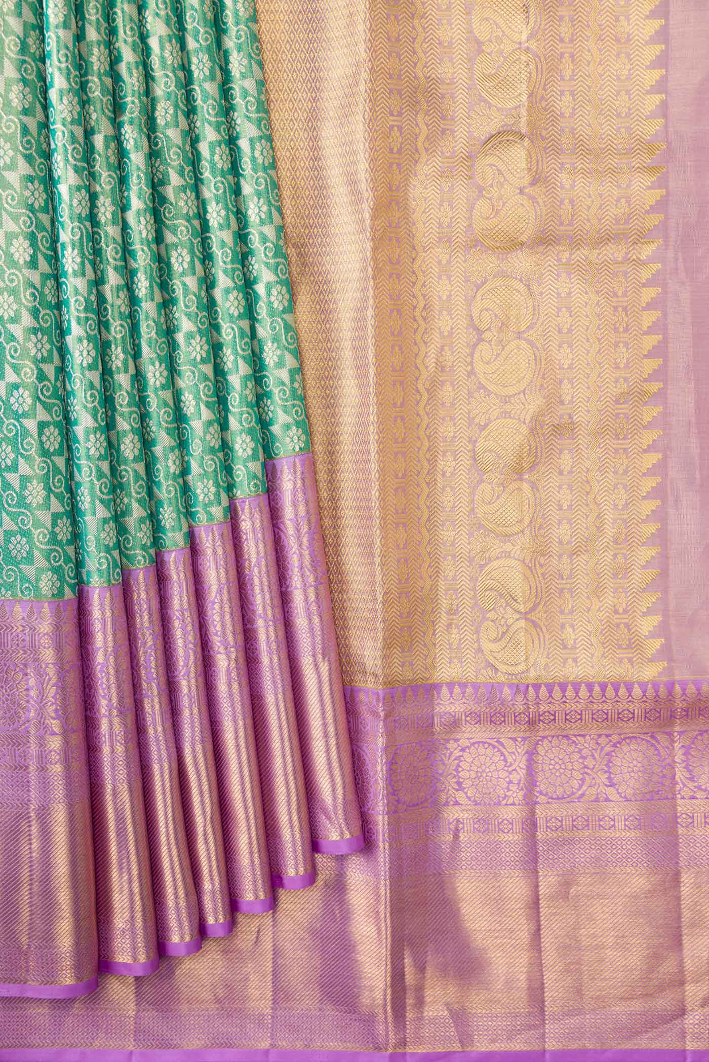Pleats and pallu of Green Dual Tone Kanchipuram Tissue Silk Saree with Zari Brocade on the body and Zari Border