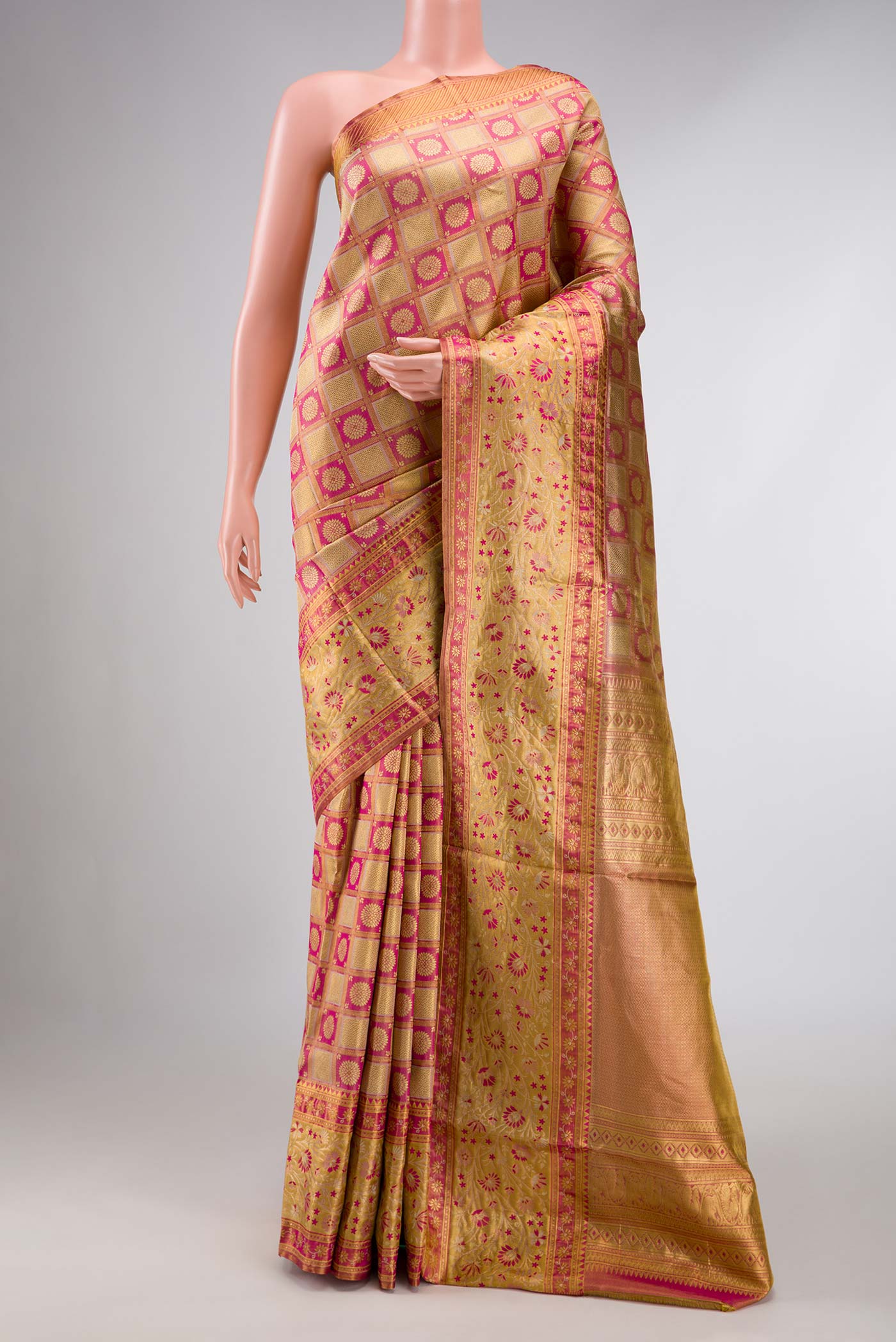 Pink Dual Tone Kanchipuram Tissue Silk Saree with Zari Brocade on the body and Zari Border displayed on a mannequin