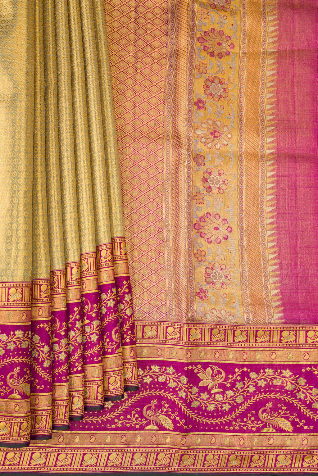 Pleats and pallu of Gold Dual Tone Kanchipuram Tissue Silk Saree with Zari Brocade on the body and Zari Border. 