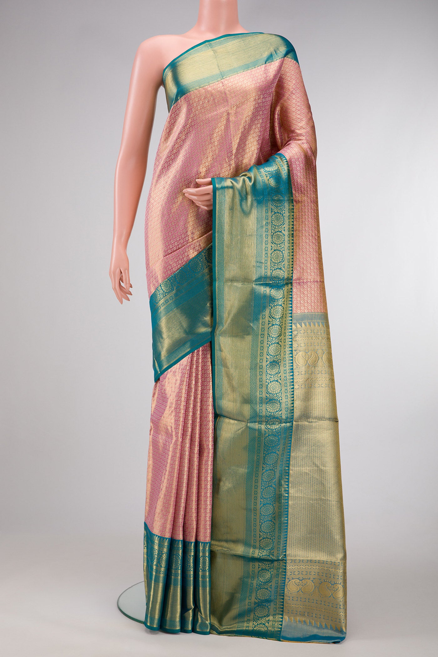 Pink Dual Tone Kanchipuram Tissue Silk Saree with Zari Brocade on the body and Zari Border.  displayed on a mannequin
