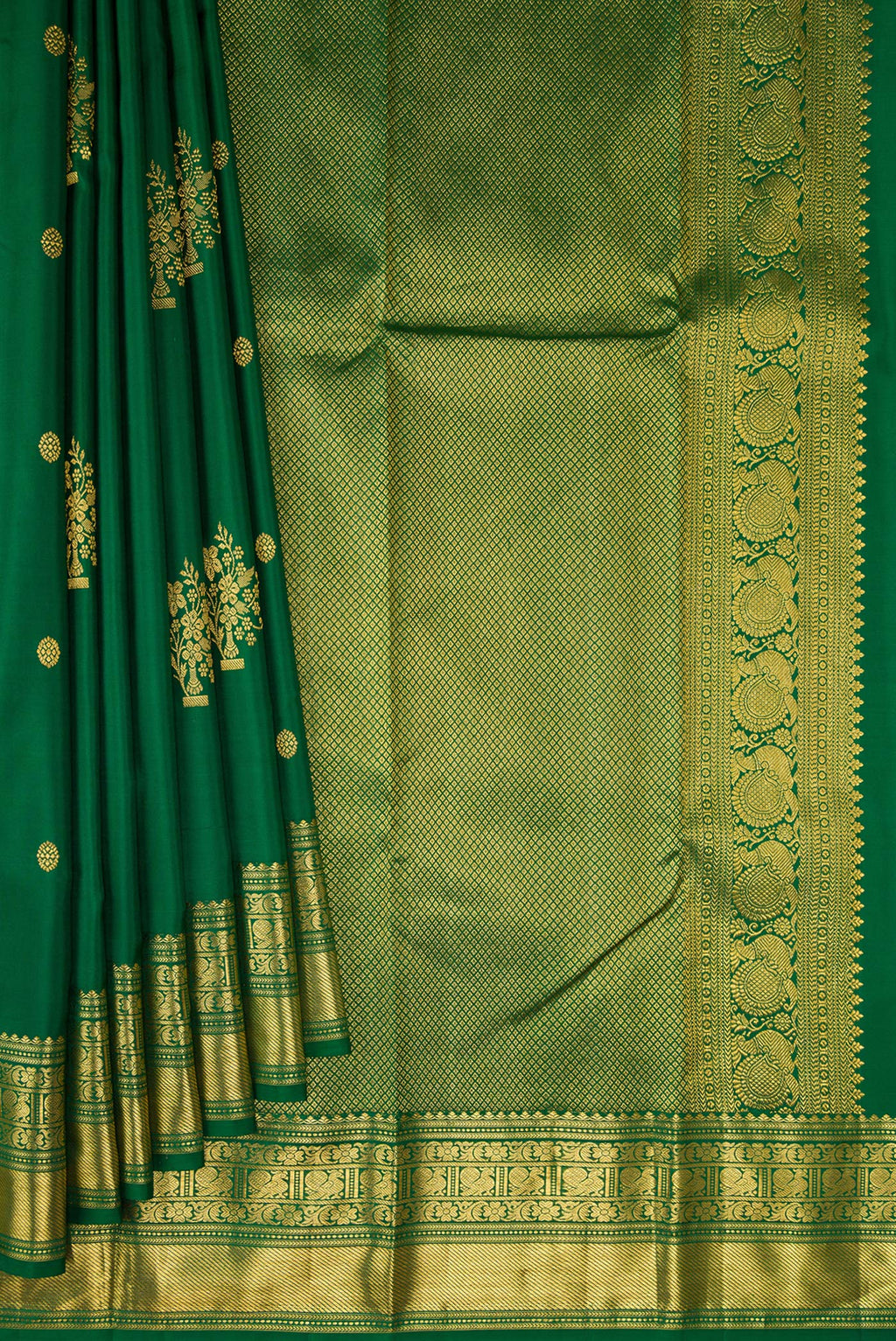 Pleats and pallu of Bottle Green Kanchipuram Silk Saree with Zari Butta on the body and Fancy Border. 
