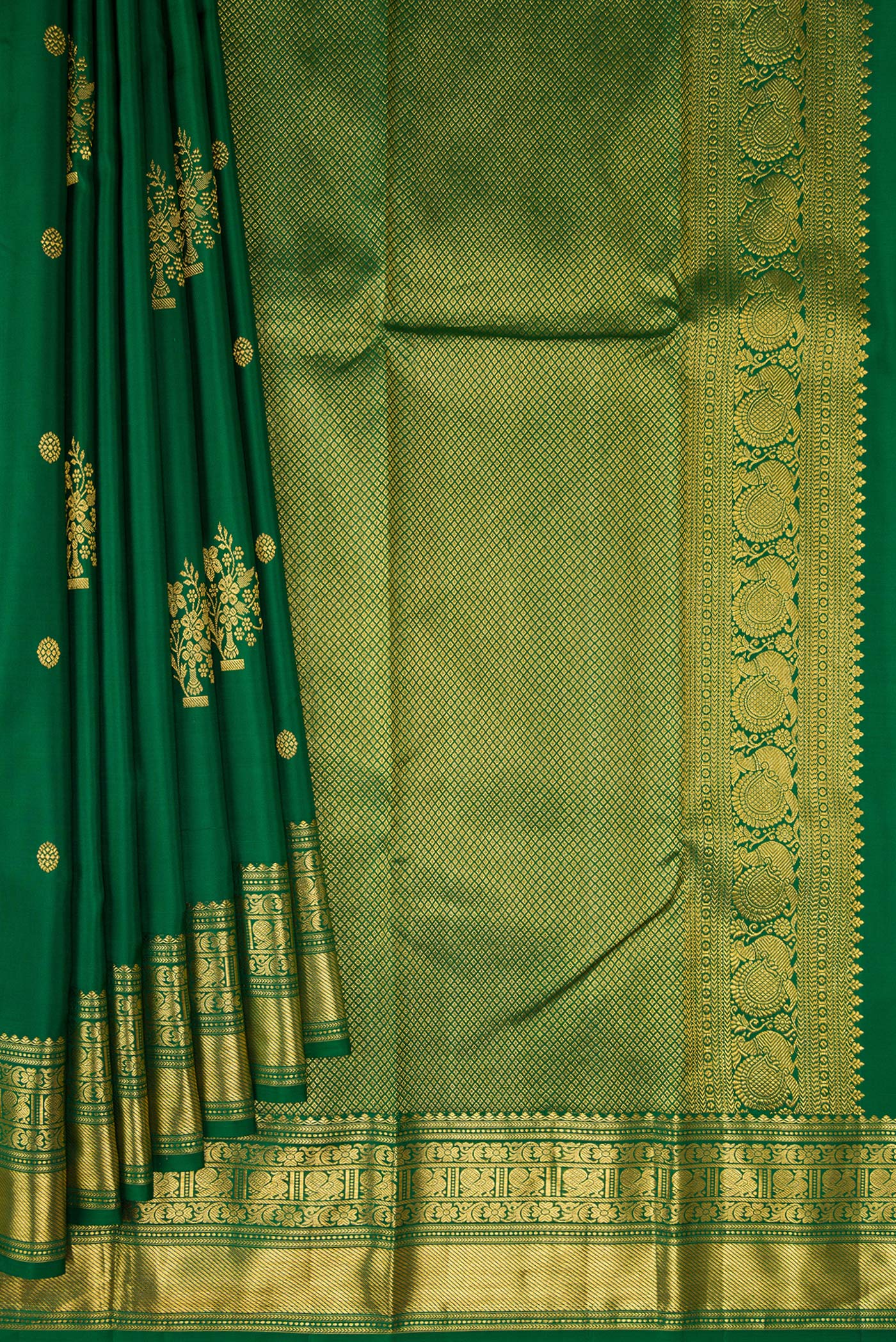Pleats and pallu of Bottle Green Kanchipuram Silk Saree with Zari Butta on the body and Fancy Border. 