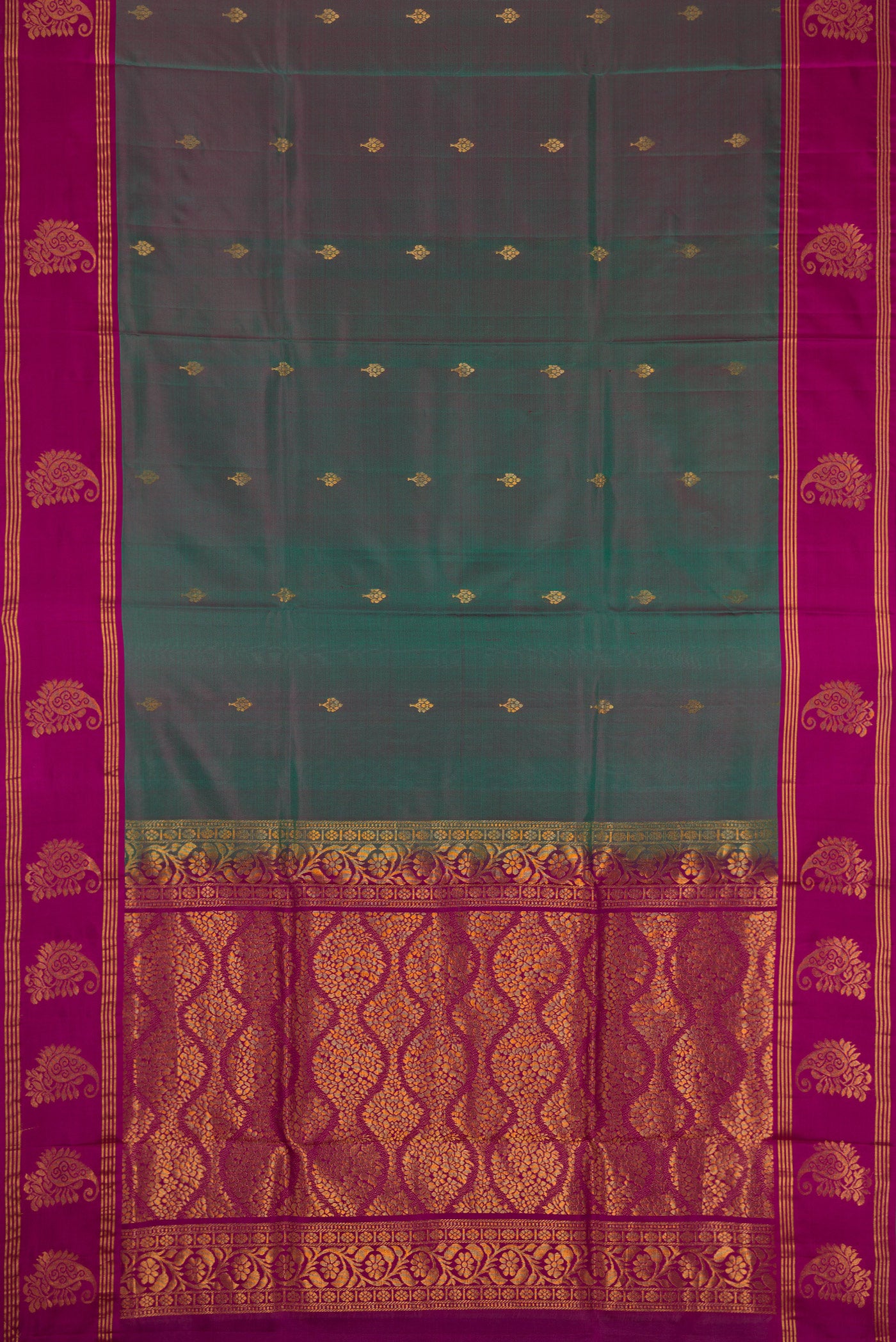 Green Dual Tone Soft Silk Saree with Zari Butta on the body and Fancy Border.  displayed on a mannequin