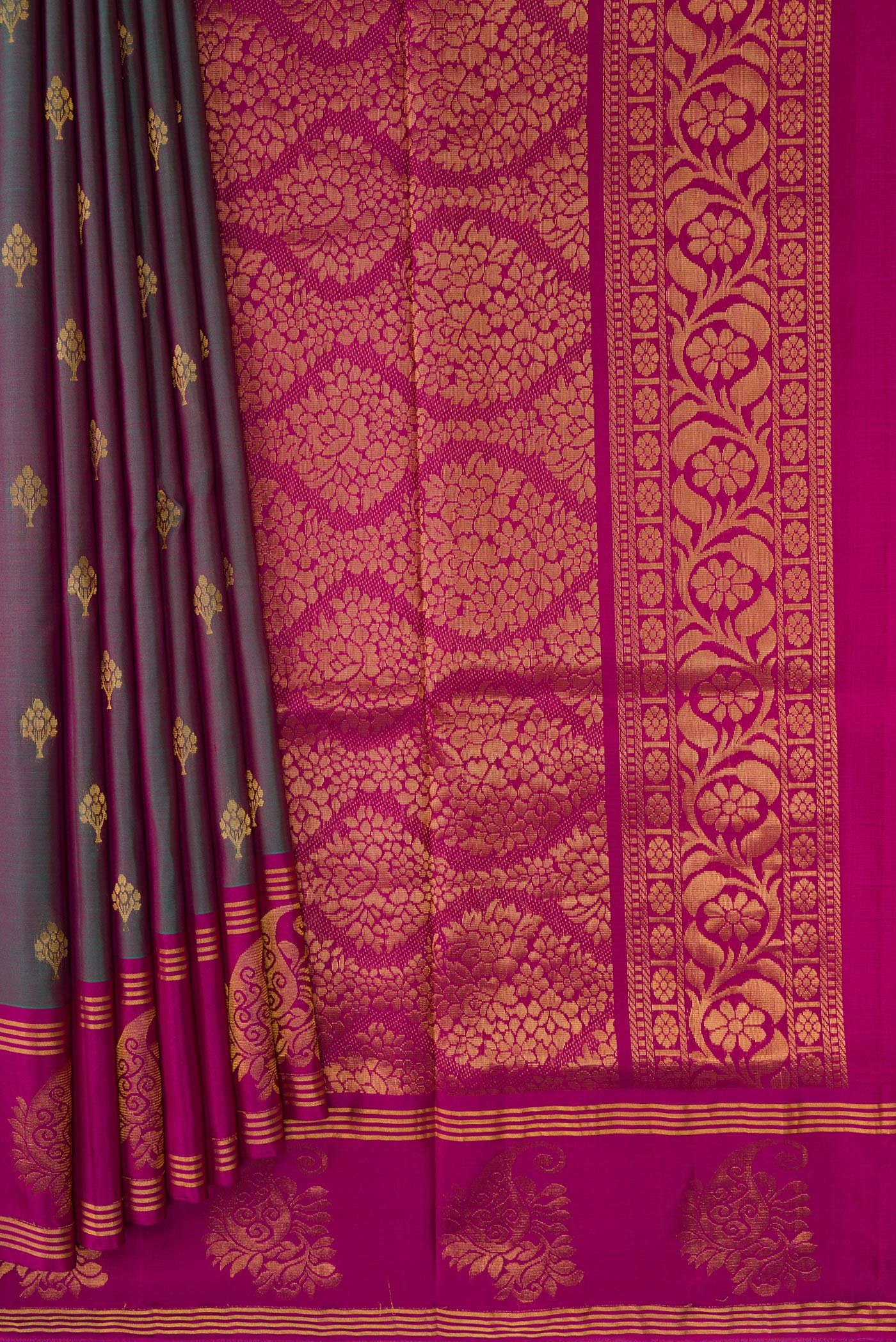 Pleats and pallu of Green Dual Tone Soft Silk Saree with Zari Butta on the body and Fancy Border. 