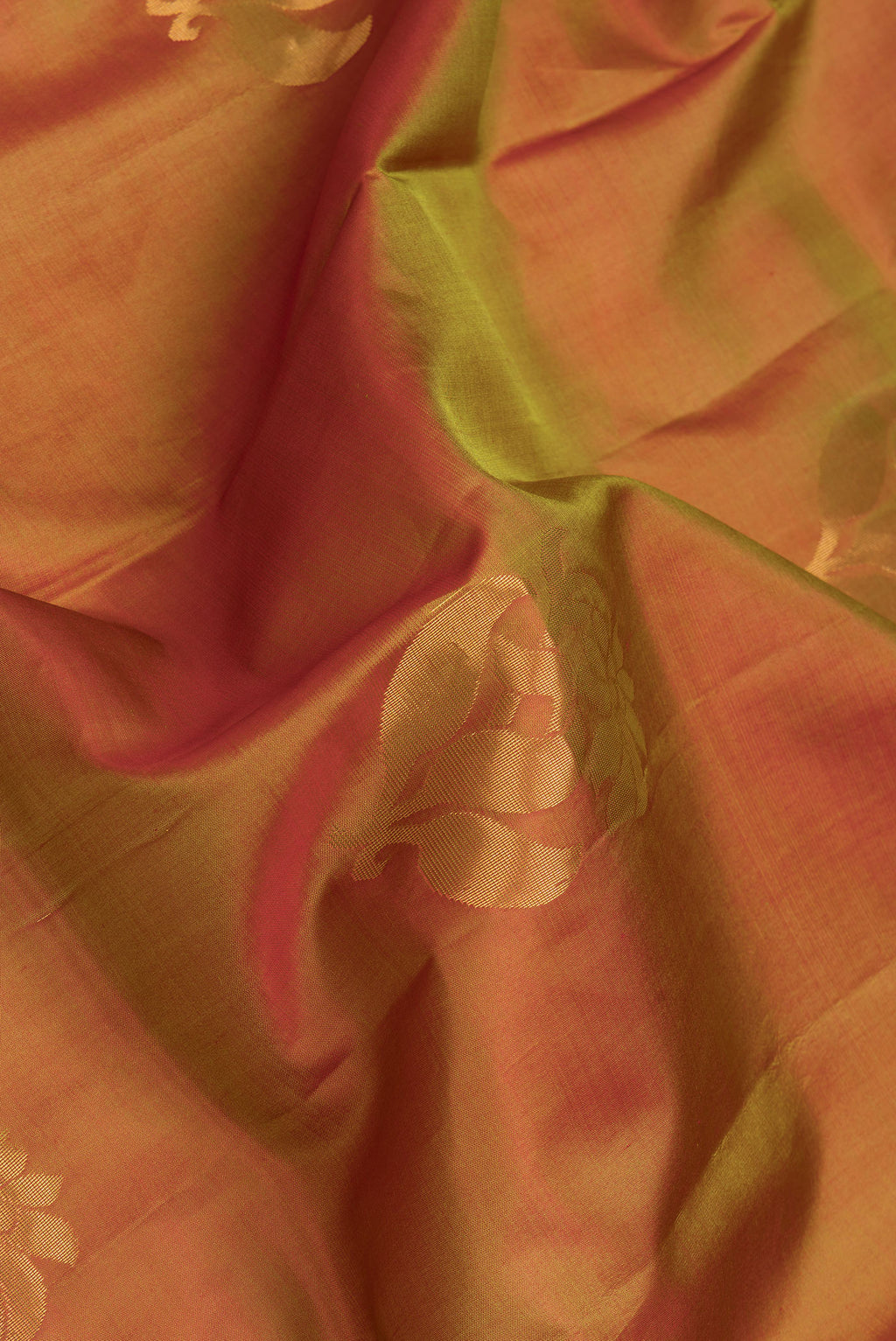 Close up of Mehandi Green Dual Tone Soft Silk Saree with Zari Butta on the body and Zari Border.  displaying folds