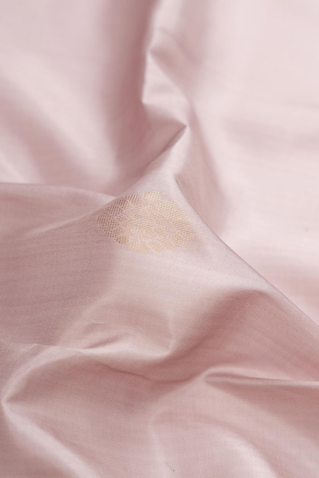 Close up of Lavender Dual Tone Soft Silk Saree with Zari Butta on the body and Fancy Border.  displaying folds