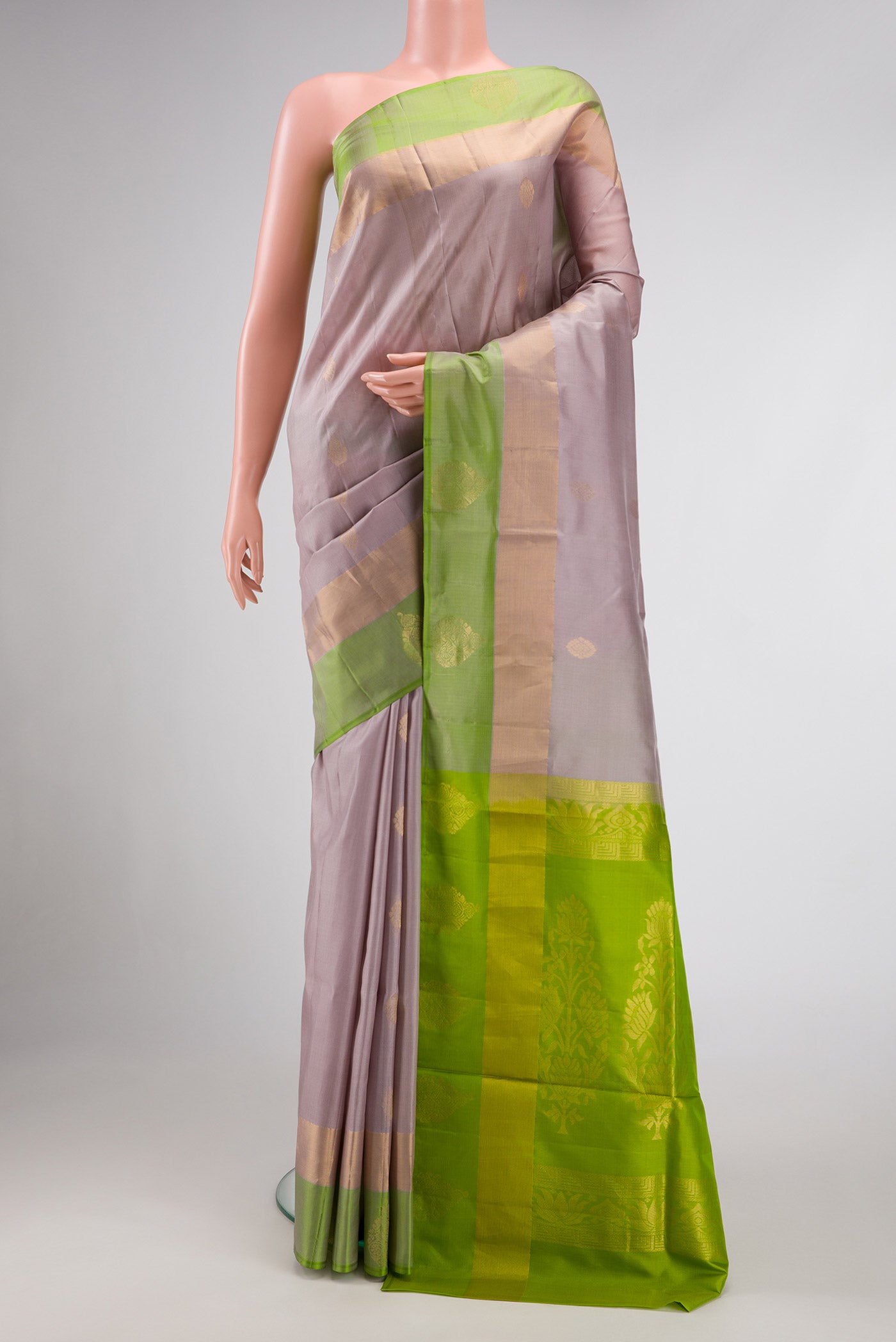 Lavender Dual Tone Soft Silk Saree with Zari Butta on the body and Fancy Border.  displayed on a mannequin