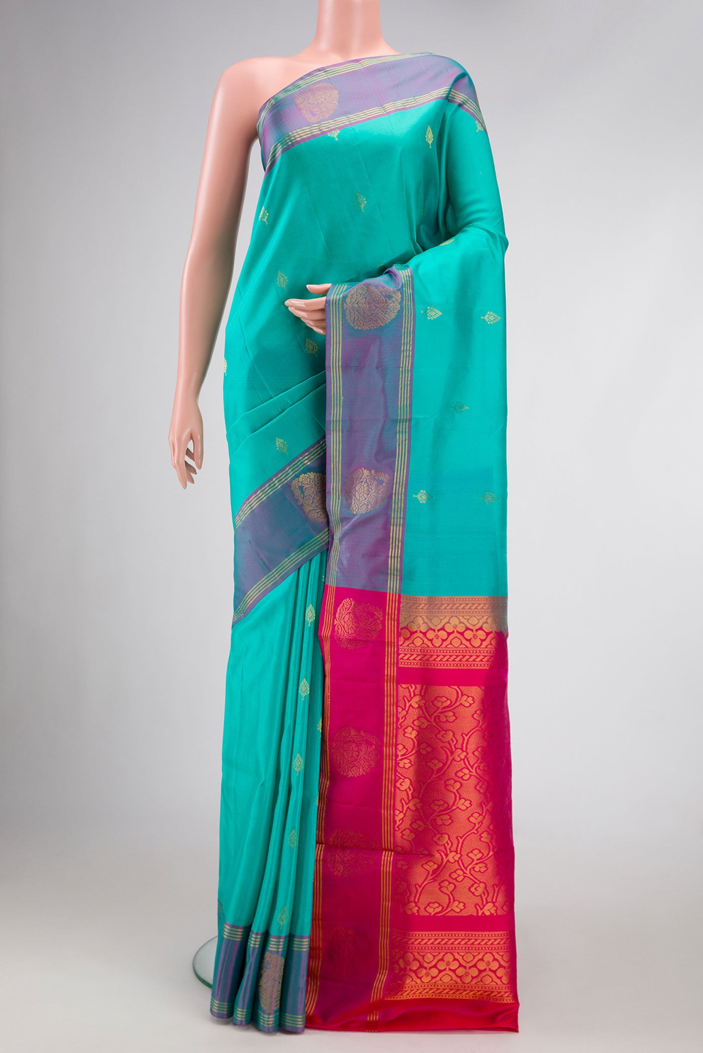 Sky Blue Dual Tone Soft Silk Saree with Zari Butta on the body and Zari Border.  displayed on a mannequin