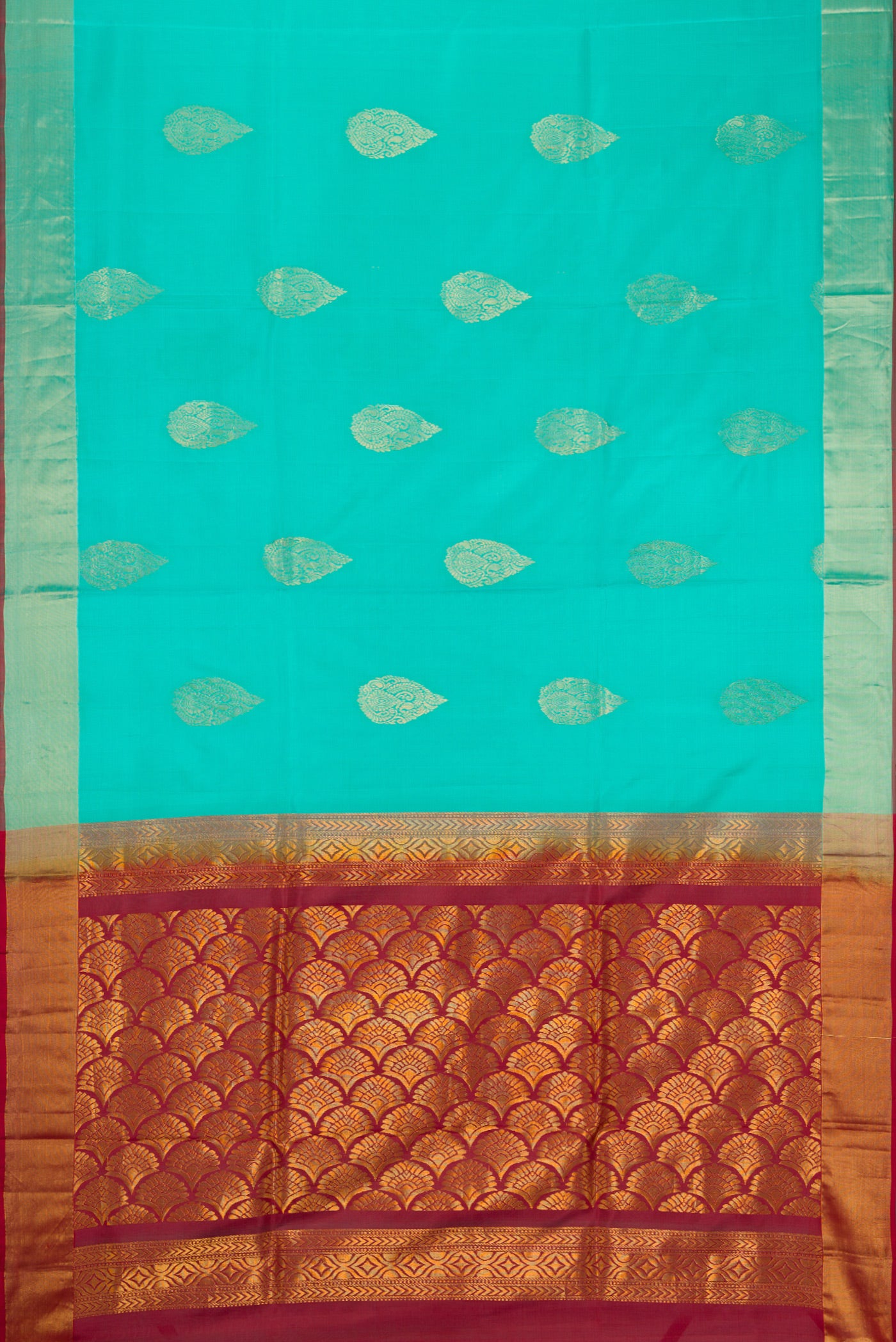 Sky Blue Soft Silk Saree with Zari Butta on the body and Zari Border.  displayed on a mannequin
